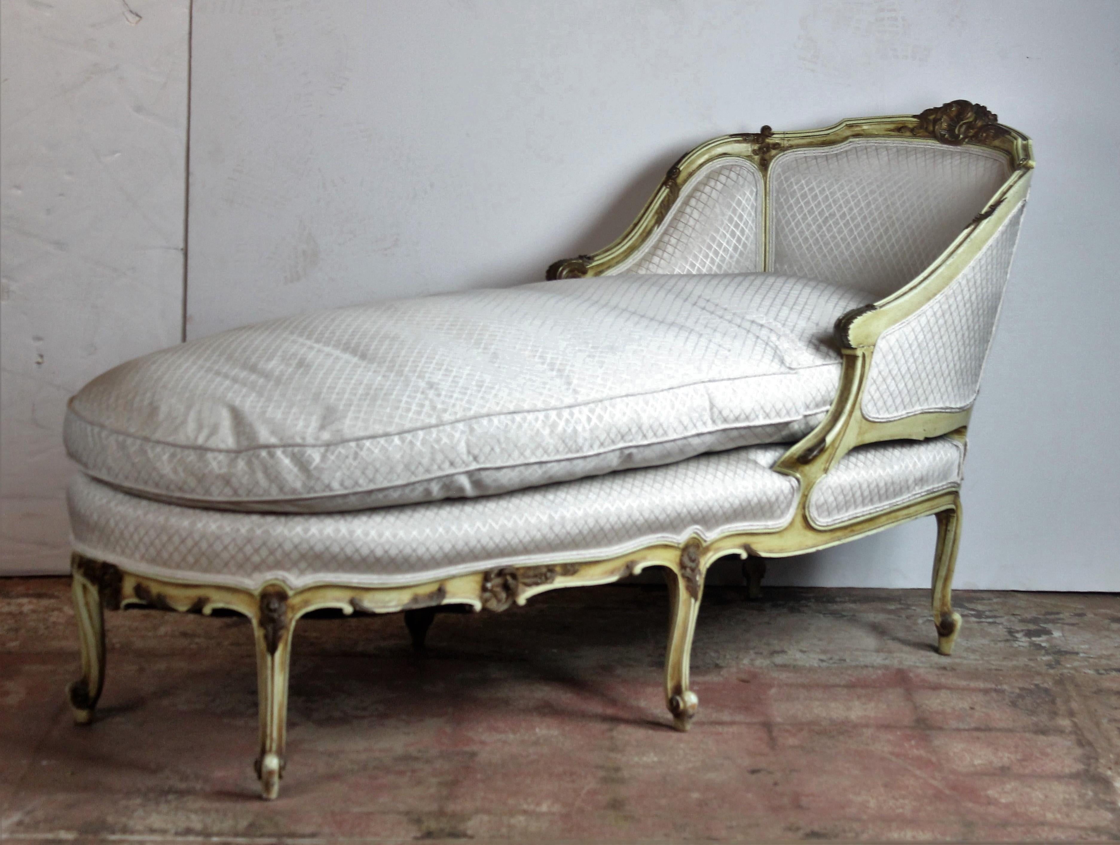 Wood carved Louis style French chaise. Original upholstery. The cushion is down wrap.