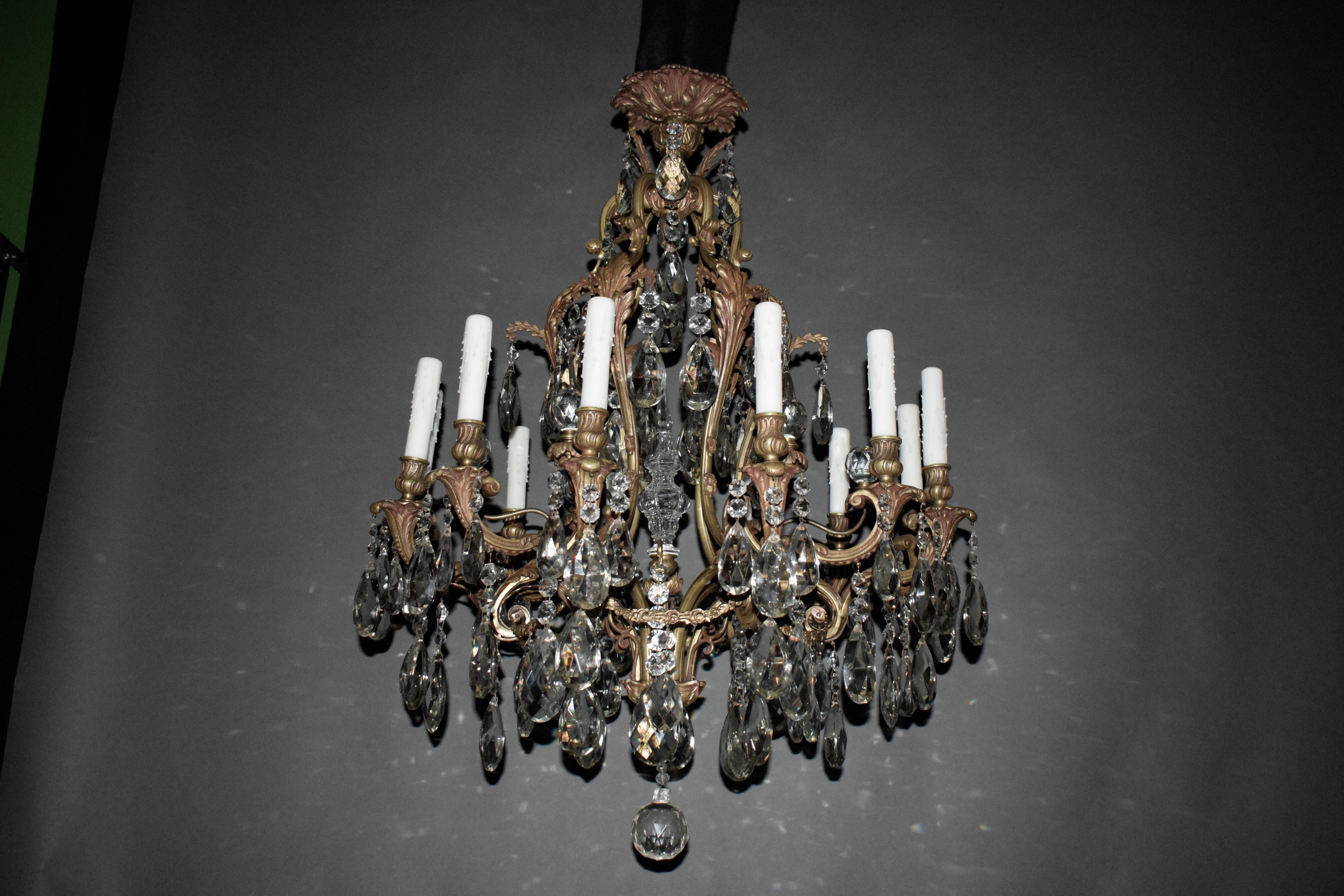A very fine gilt bronze & cut crystal chandelier in the Louis XV style. 12 lights.
France, circa 1920. Height 39