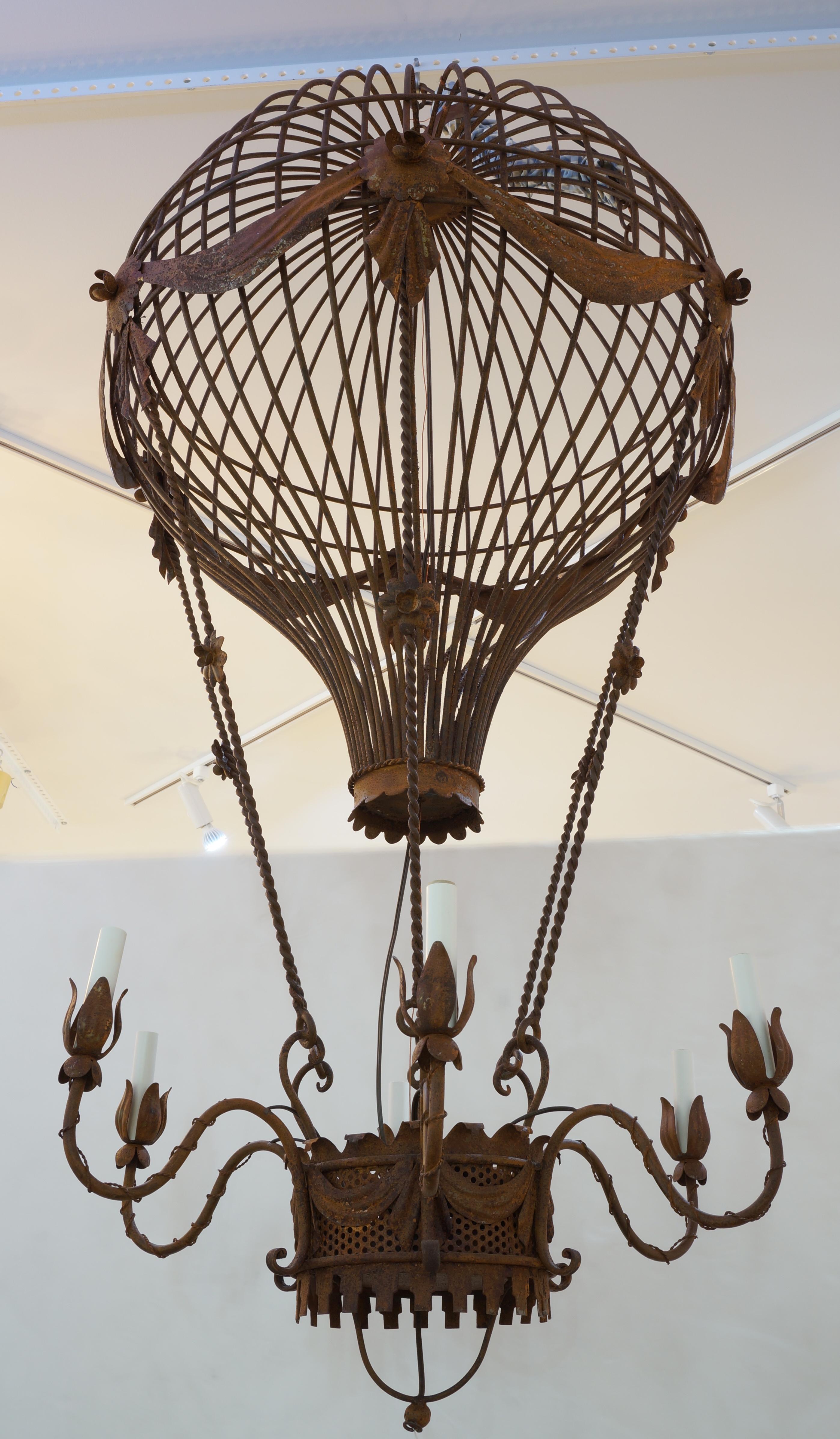 This styish and chic Louis XVI style chandelier dates to the 1960s and it's large scale makes a definite statement with its form and finish. 

Note: Requires six candleabra bulbs. 

Note: Diameter is approximately 31