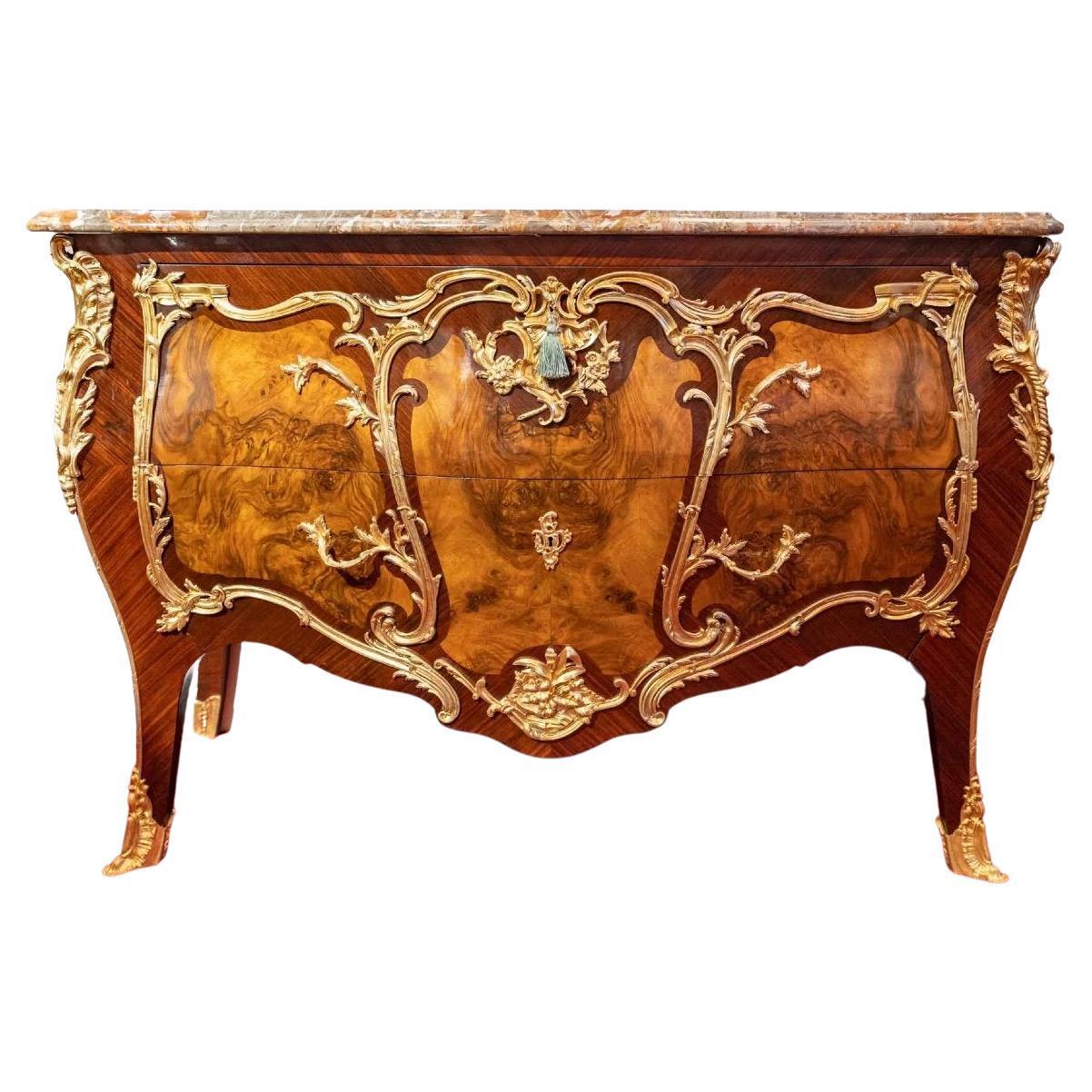 Louis XV style chest of drawers with elm wood veneer and gilt bronze ornaments
Veined Breche marble top
In perfect condition
Measures: H: 95 cm, W: 147 cm, D: 64 cm.