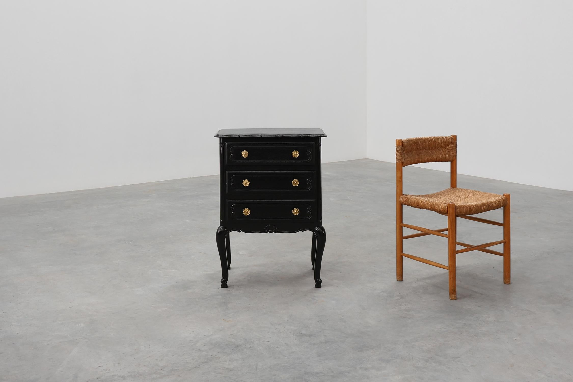 France / 1950 / chest of drawers / oak / Louis XV 

A refined French Louis XV style chest of drawers from the 1950s, crafted in solid oak and newly finished in a lustrous black lacquer. The piece features three drawers adorned with elegant gilt