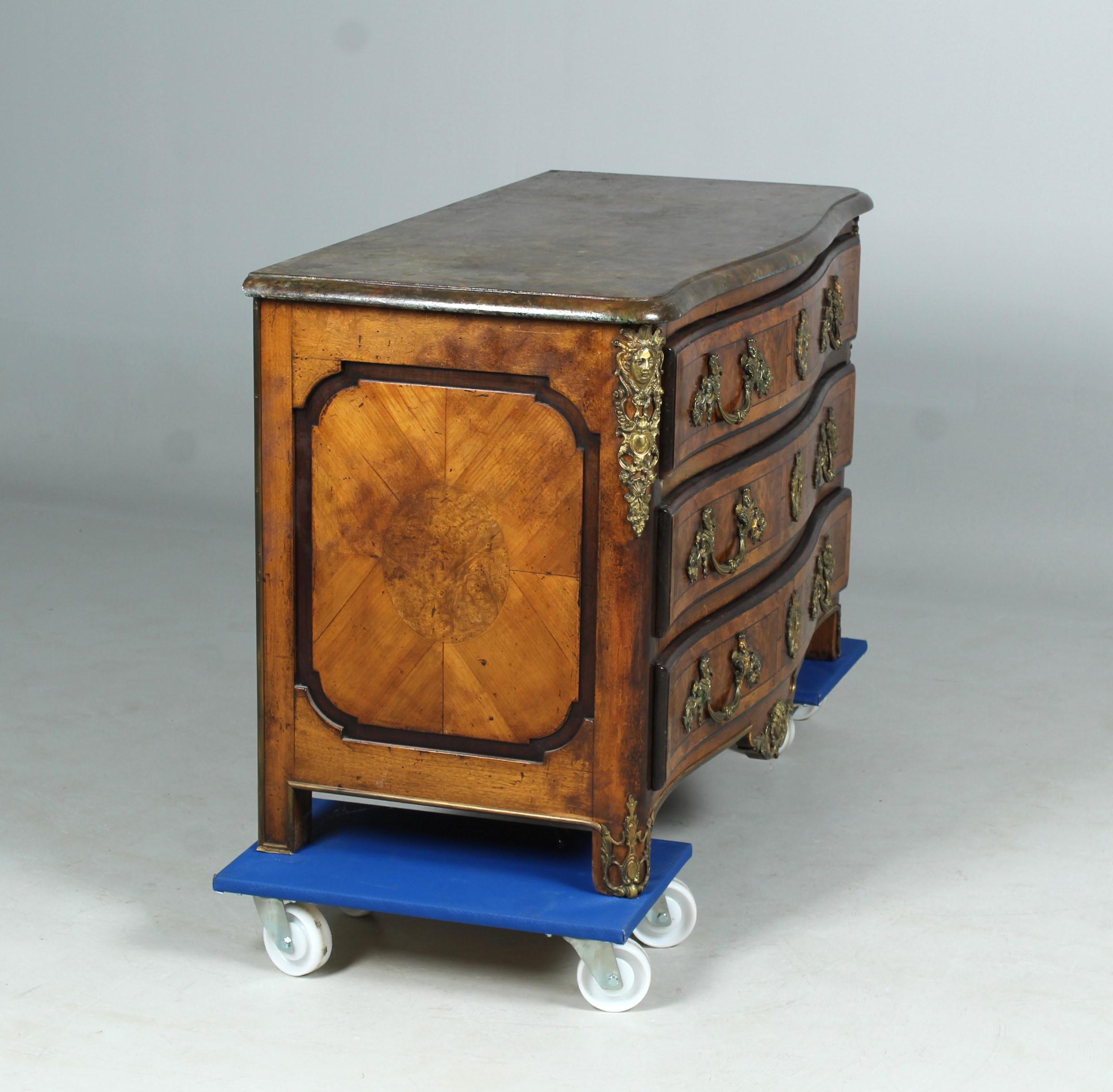Unrestored Regence style chest of drawers made in France in the late 19th - or early 20th century.

Highly crafted piece of furniture with fine marquetry and impressive bronzes.
Loosely applied marbled granite top.

Dimensions: H x W x D: 82 x 130 x