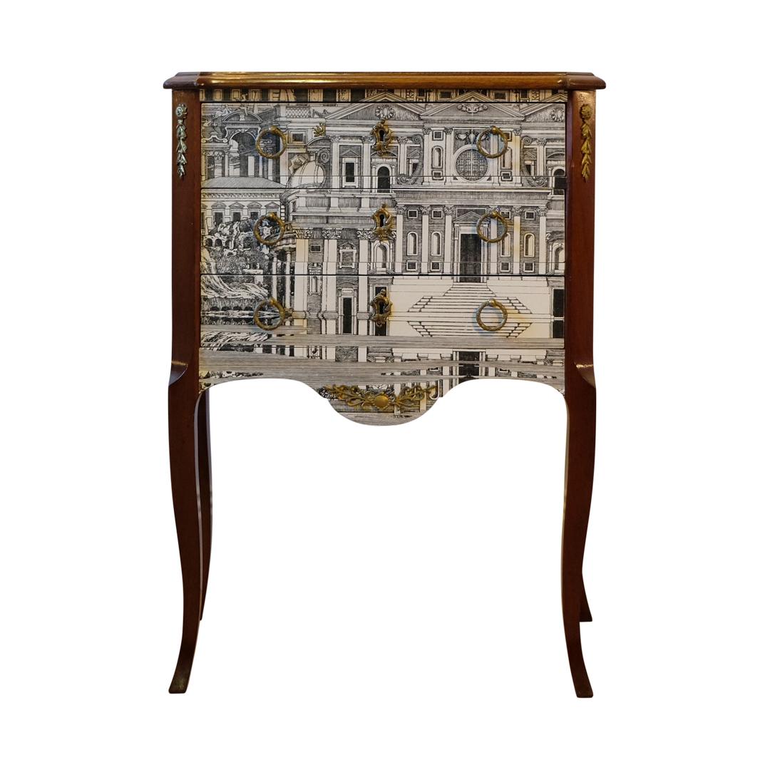 A Louis XV style chest with original brass details, wooden top and original brass handles with a Fornasetti pattern of ancient Rome. 
Width: 48cm / 18.9