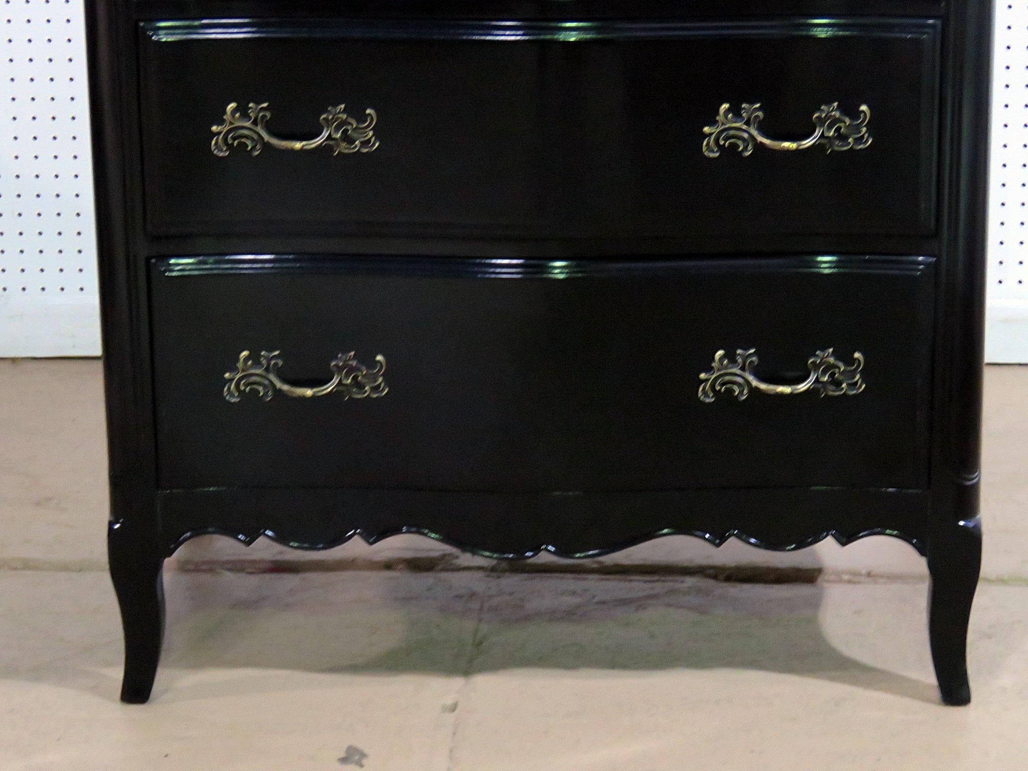 When a French country piece has been ebonized in black lacquer all of the sudden it becomes a focal point and rather chic. This gorgeous stand or commode, has a tuxedo finish with rural roots. This is a pleasure to look at and a fine addition to
