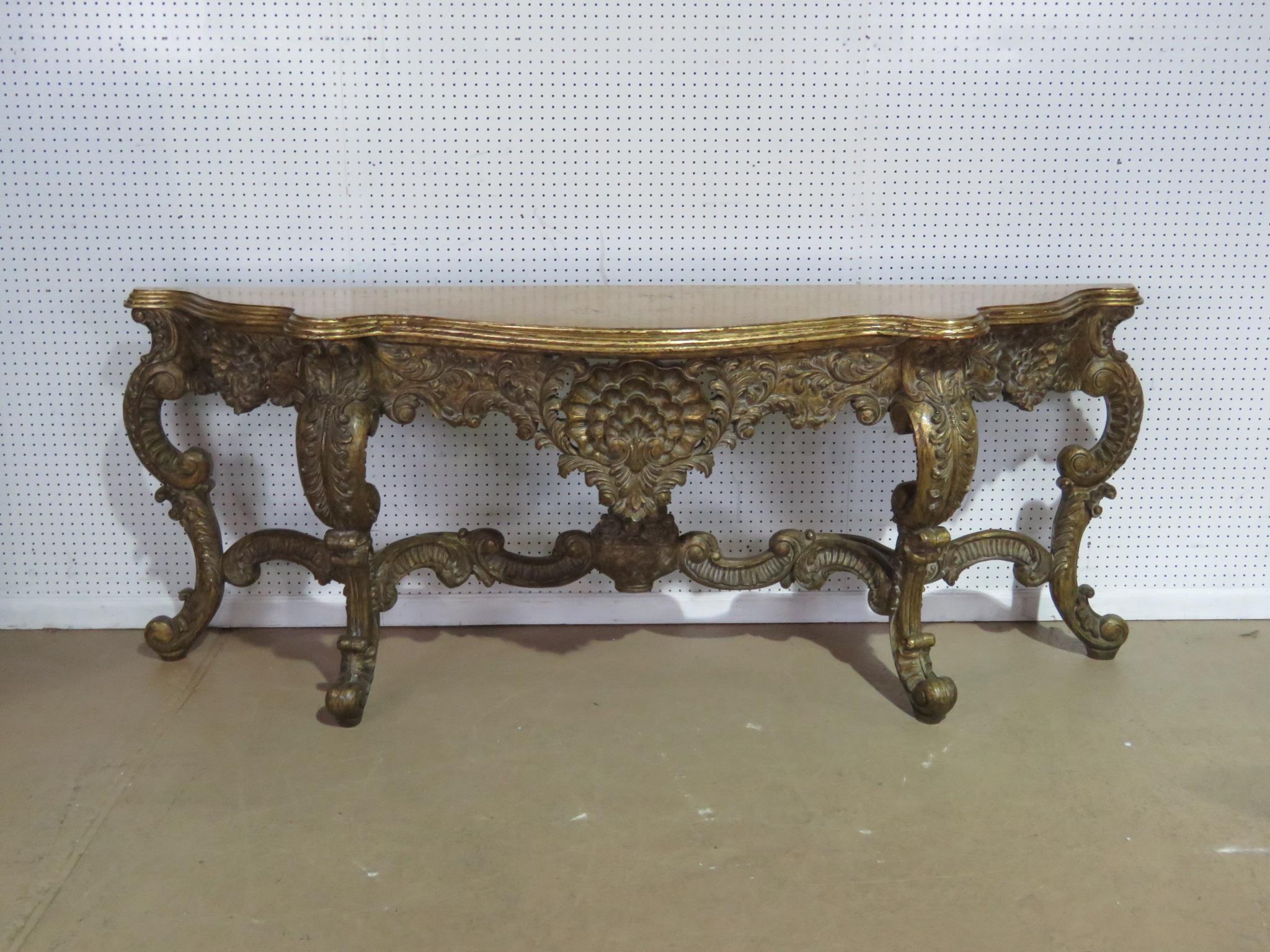 Louis XV style gilt carved console table.