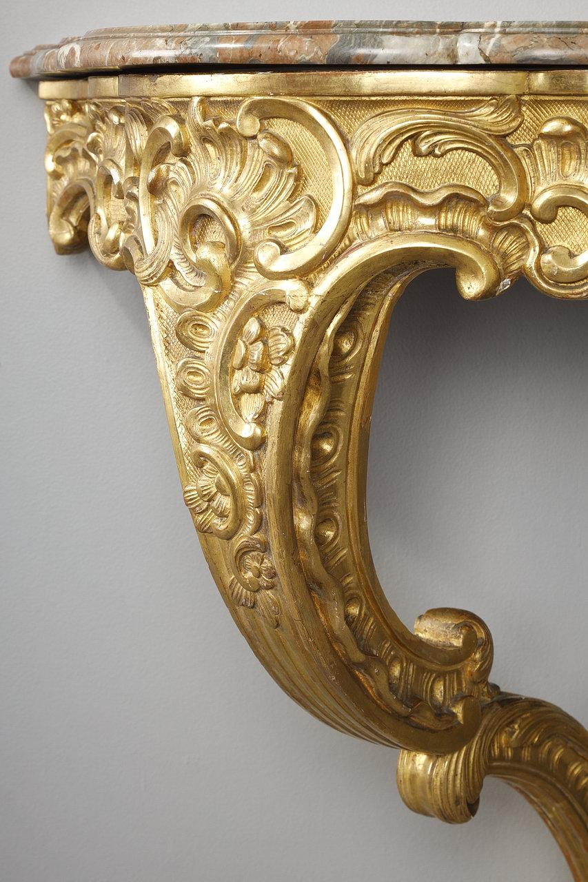 Carved Louis XV style corner console in gilded wood and Breche marble top, 19th century For Sale