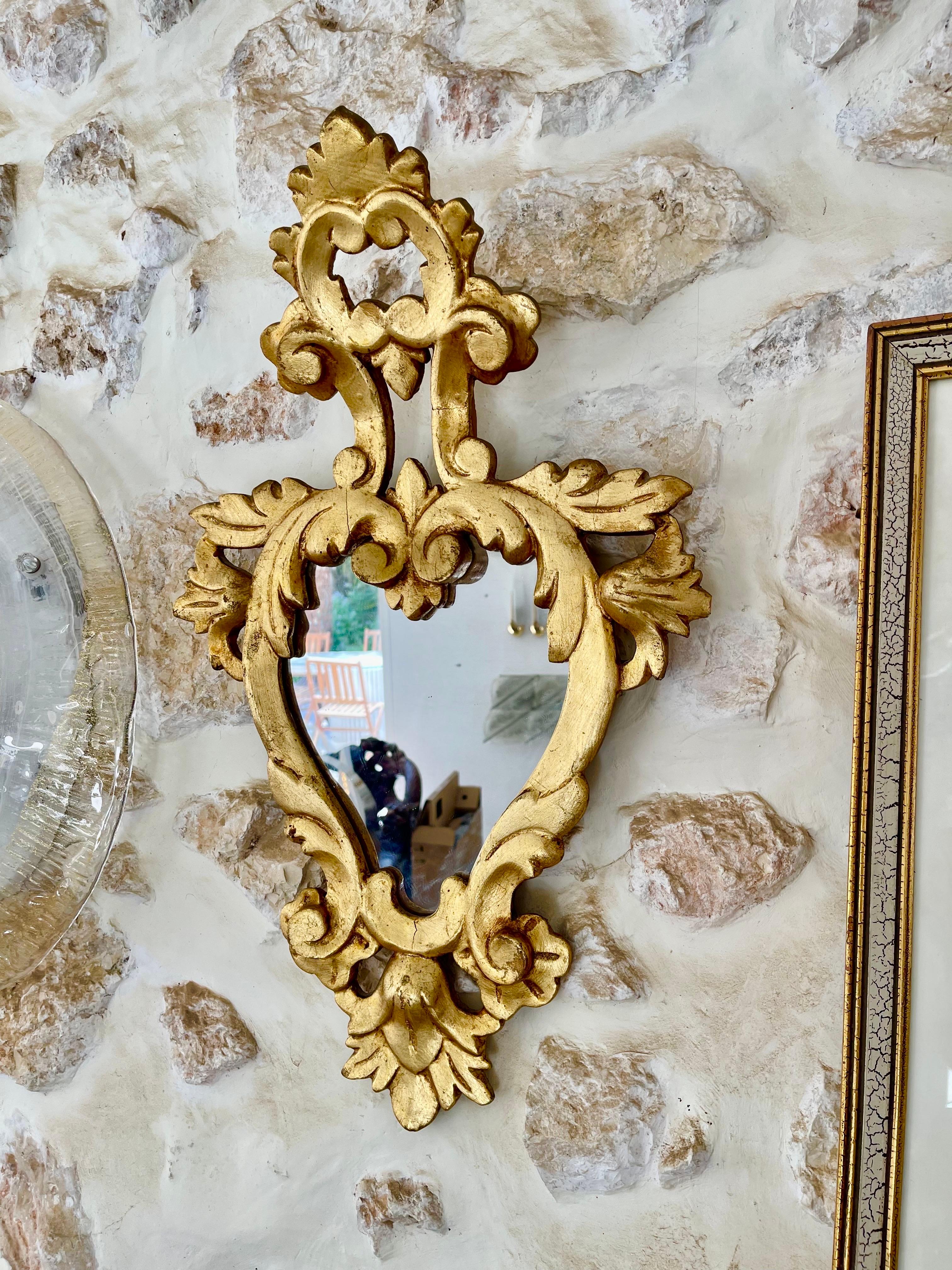 Buying a Louis XV style cornucopia mirror in wood and gilding is appealing because:
	•	Exquisite Craftsmanship and Artistic Detail: These mirrors feature intricate hand-carved wood frames with motifs like laurel, acanthus leaves, flowers, and fruit