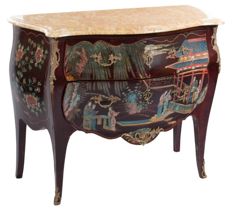 A Louis XV, transitional-style, Bombay and serpentine commode with conforming marble top and ormolu mounts beautifully lacquered on the front and sides with colorful depictions of multiple figures in vibrant costumes strolling in pleasure gardens