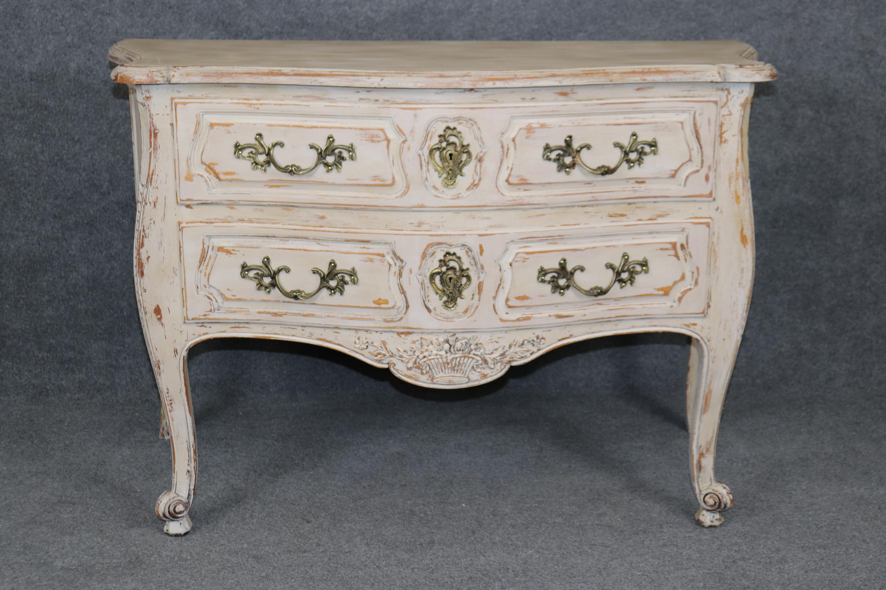 Dimensions - H: 34 1/2in W: 51 1/4in D: 24 1/4in

This Louis XV Style Country French Two Drawer Distressed Paint Decorated Commode is truly a unique piece and was made with quality in mind! We can tell this piece is of high quality due to the