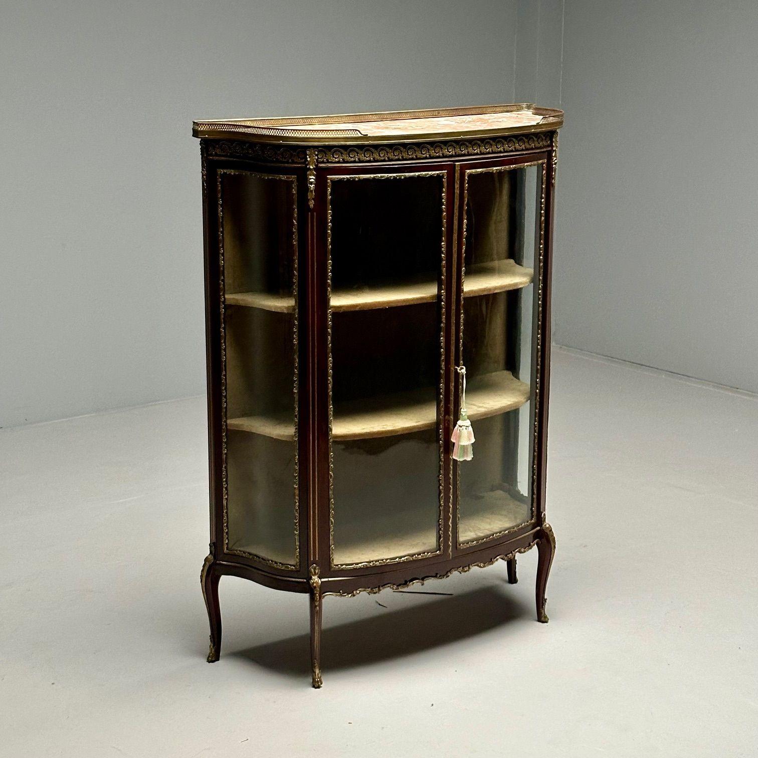 Louis XV Style, Curio Cabinet, Mahogany, Bronze, Glass, France, 1910s
 
A stunning bow front curio case with curved glass sides, reminiscent of times past, dating from the late 19th or early 20th century.  Bronze mounts are featured throughout with