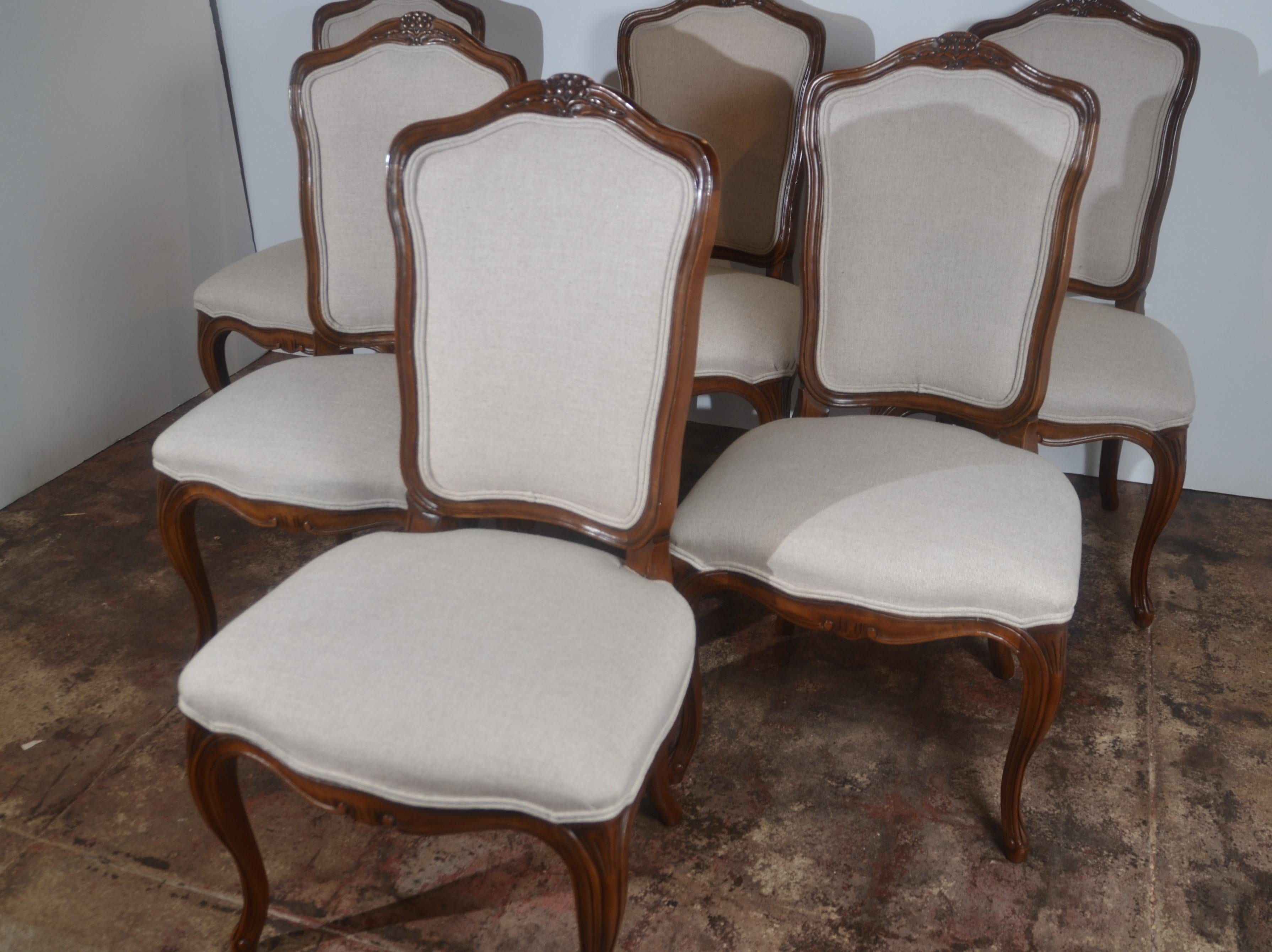 Louis xv style set of six dining chairs by Kindel. The chairs have been recovered in linen.