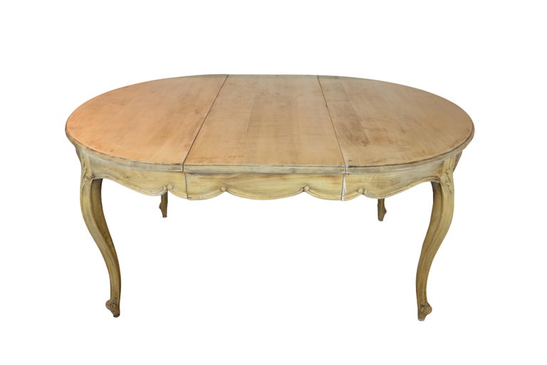 Louis XV style dining table with three leaves has a natural finish and without leaves closes into a round table. Closed 43.50