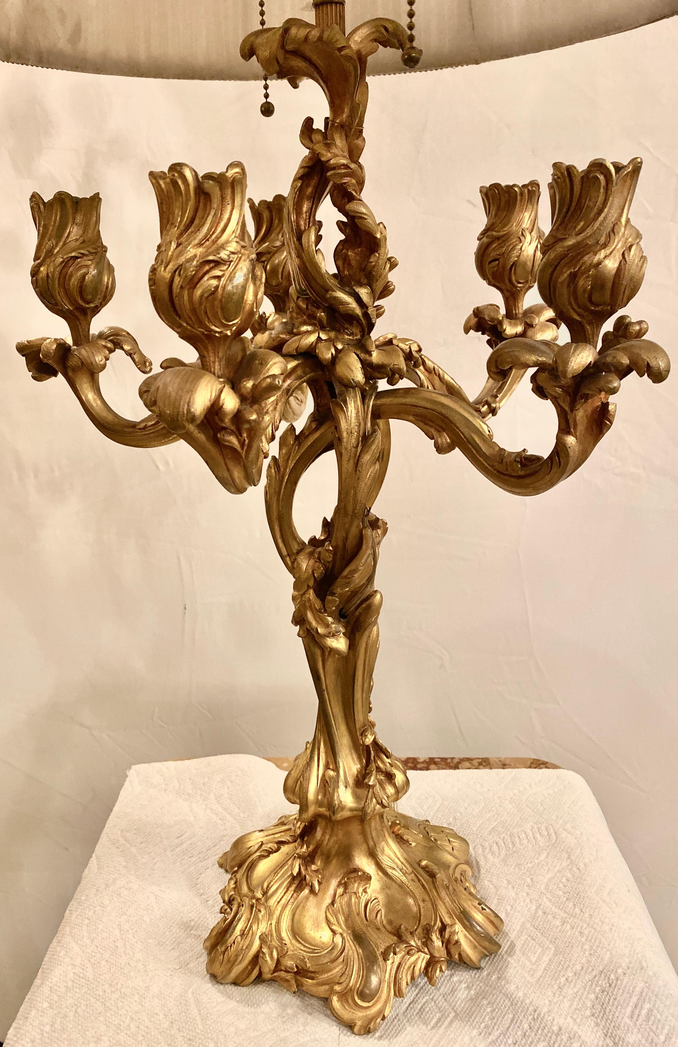 French Louis XV style doré bronze candelabra electrified having foundry Marks Paris Jullet+Cie. The twisted and finely chased candelabra has five lights with the sixth light converted into a lamp socket taking two light bulbs. The whole having a