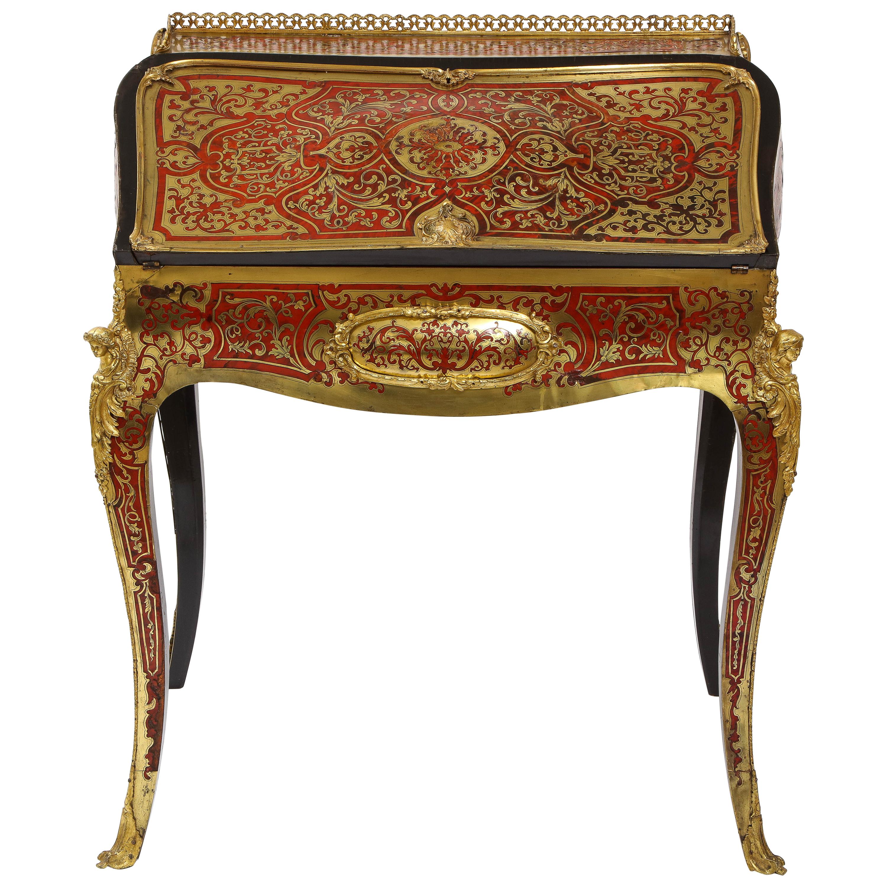 A gorgeous Louis XV style French dore bronze mounted Boulle Marquetry secretary desk or cabinet. With a cylindrical form in ebonized veneer and boulle with dore bronze mounts on a gorgeous red and orange swirling boulle veneer ground. The legs are