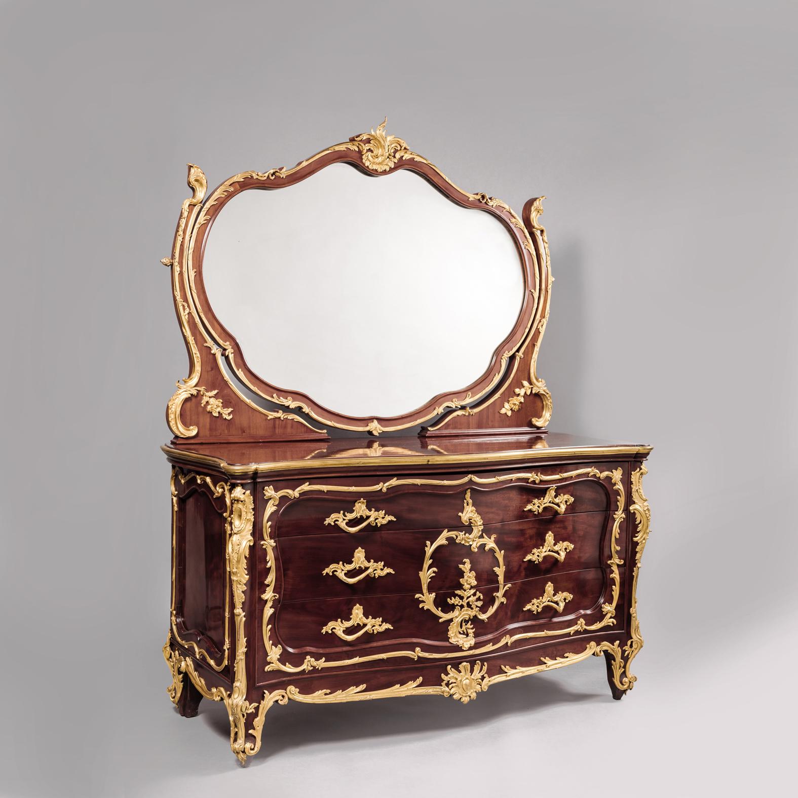 A Louis XV style gilt bronze mounted mahogany dressing table attributed to François Linke.

Two lock plates stamped 'Ch. Leidenroth Paris ALF. Schmidt Suc'. 

François Linke 

François Linke (1855-1946) was the most important Parisian cabinet