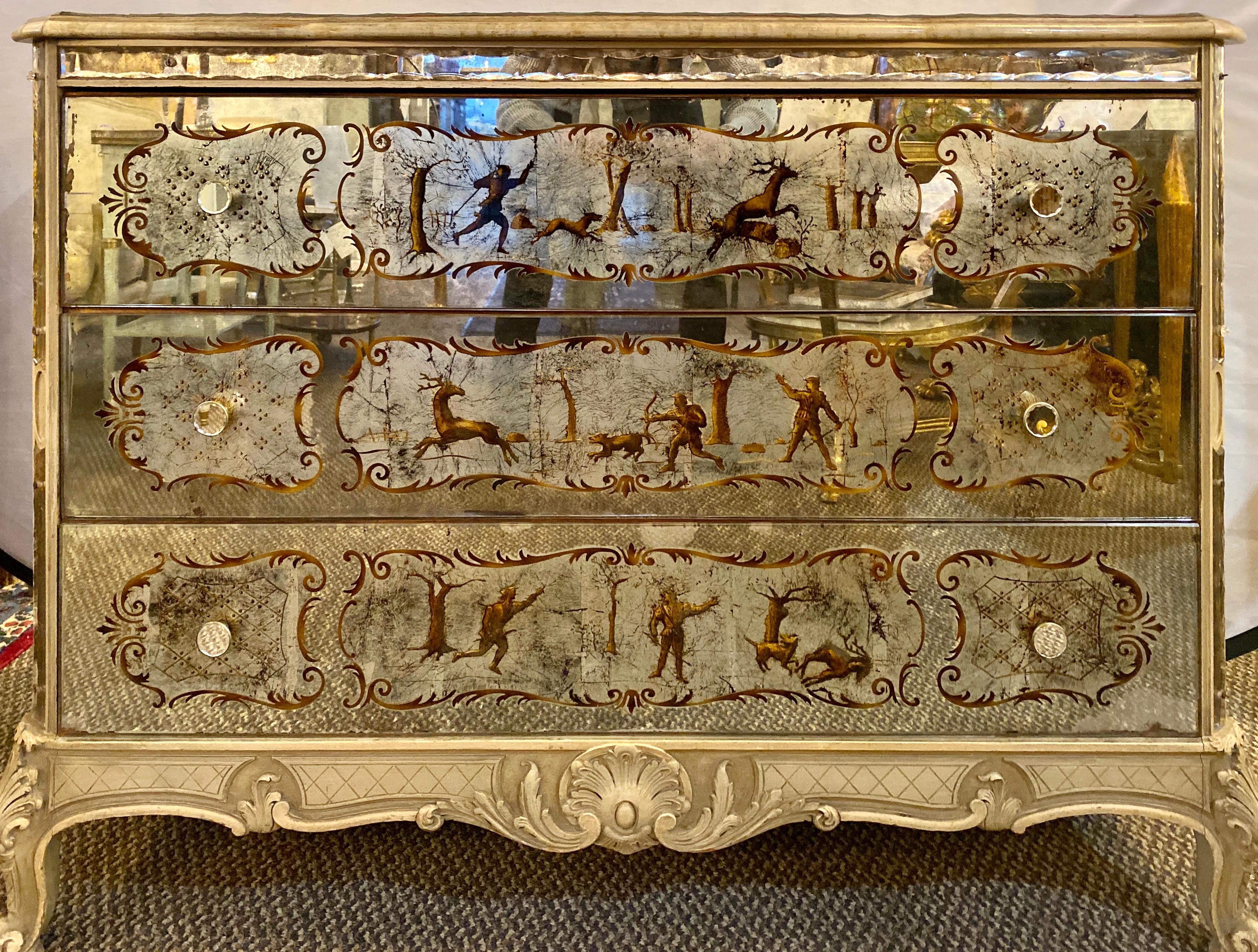 Louis XV style églomisé commode. Maison Jansen Style chest, dresser, nightstand. This simply stunning Mid-Century Modern, one of a kind commode is so versatile it can fit into any setting in the home. Having three églomisé mirror hunting paintings