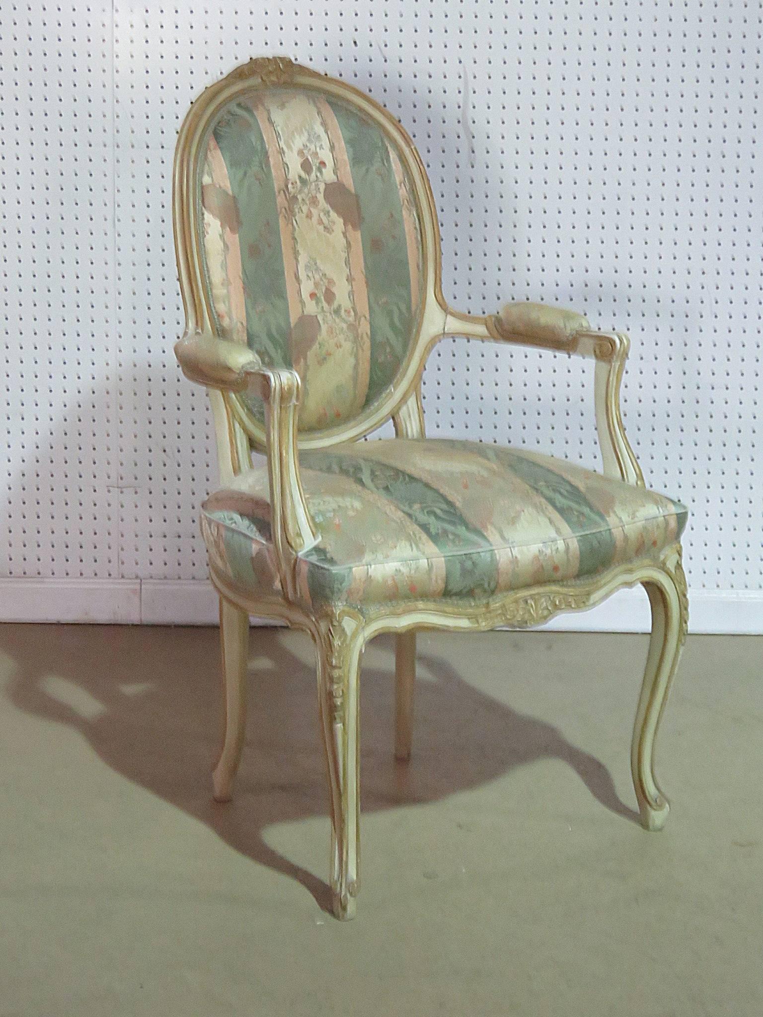 Louis XV style fauteuil by Oscar Shadell, Inc with a carved, distressed paint decorated frame.