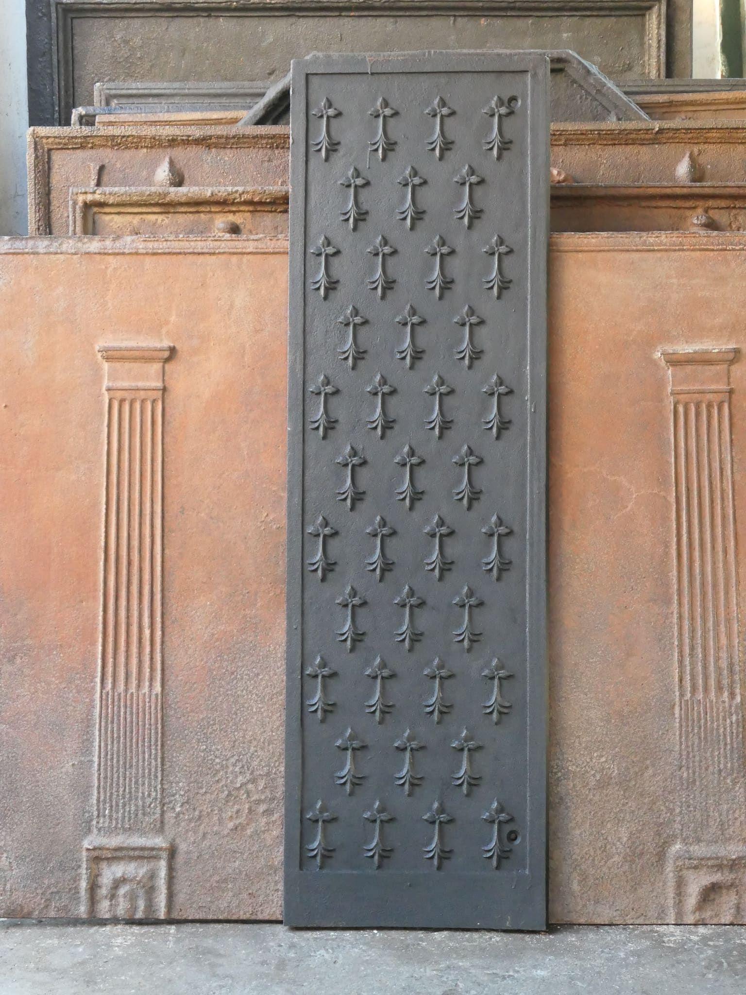 20th century French Louis XV Style fireback.

The fireback is made of cast iron and has a black patina. The fireback is in good condition and does not have cracks.
