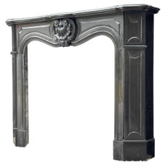 Caminetto in stile Luigi XV in marmo nero belga, circa 1880