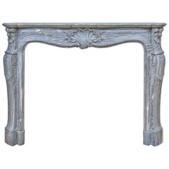 Louis XV style Fireplace in Bleu Turquin Marble