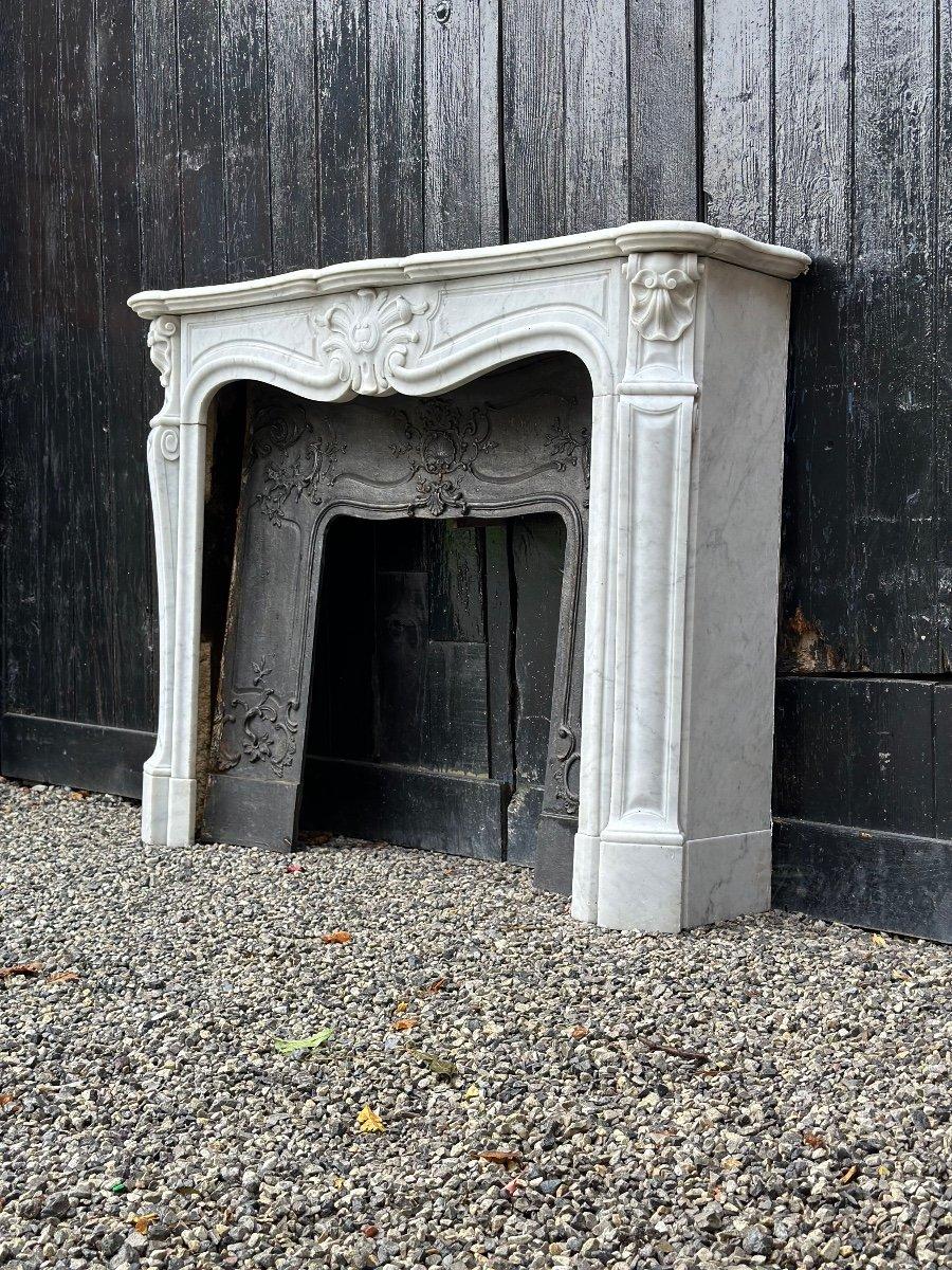 French Louis XV Style Fireplace In Carrara Marble, Cast Iron Hearth, 19th Century For Sale