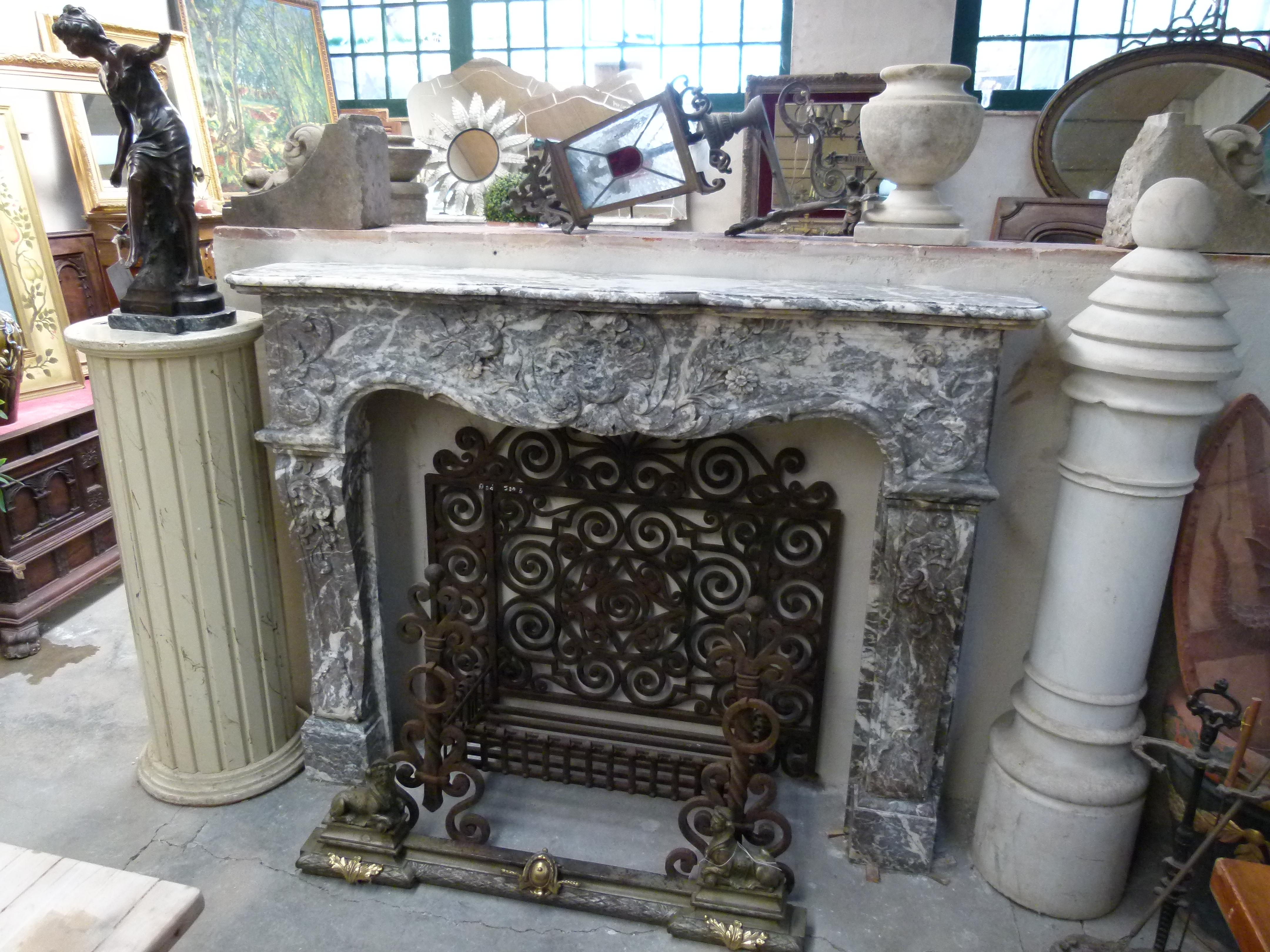 Louis XV style hand carved marble fireplace mantel from France. 