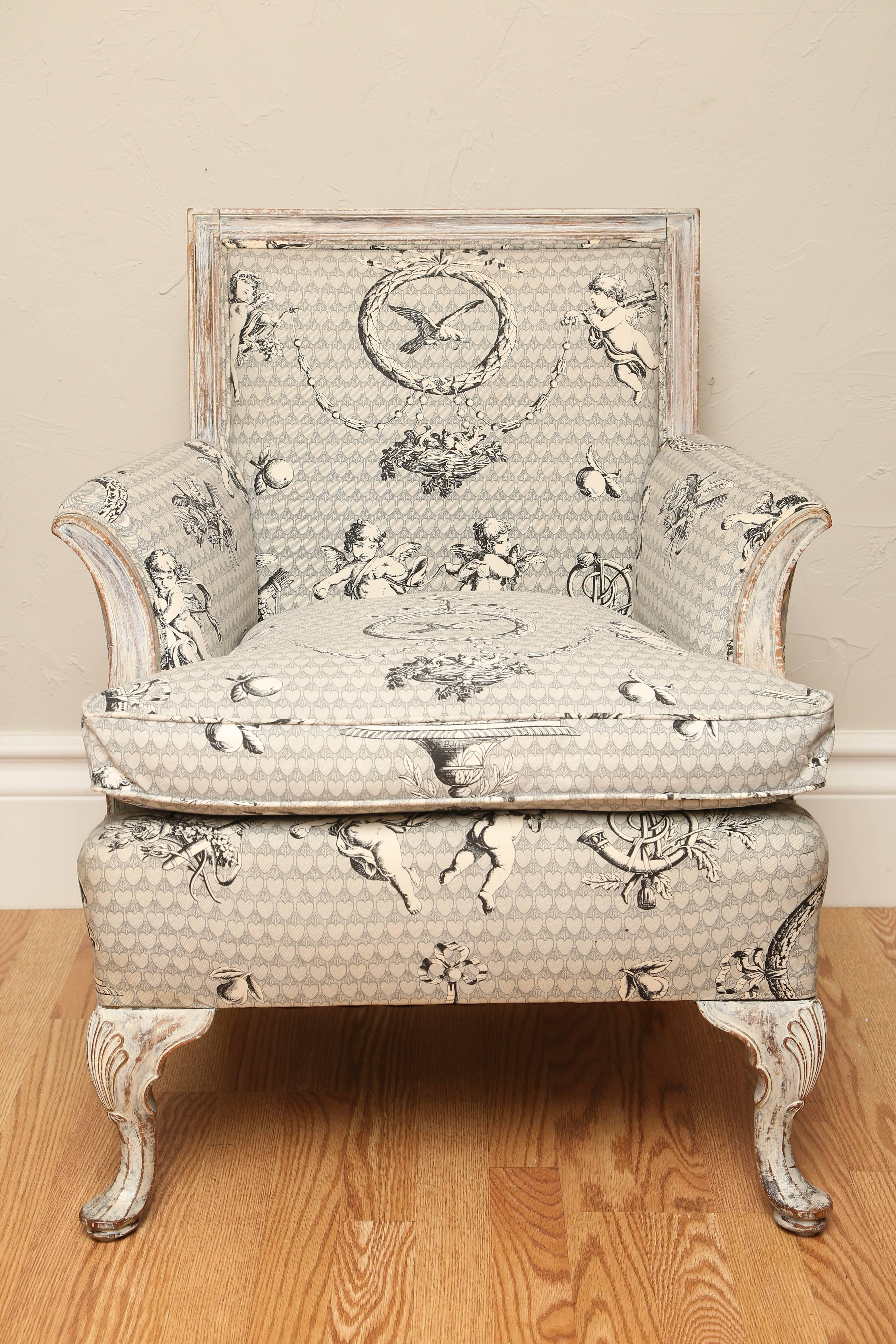 Sweet French chair upholstered in grey/white and black neoclassical putti fabric.