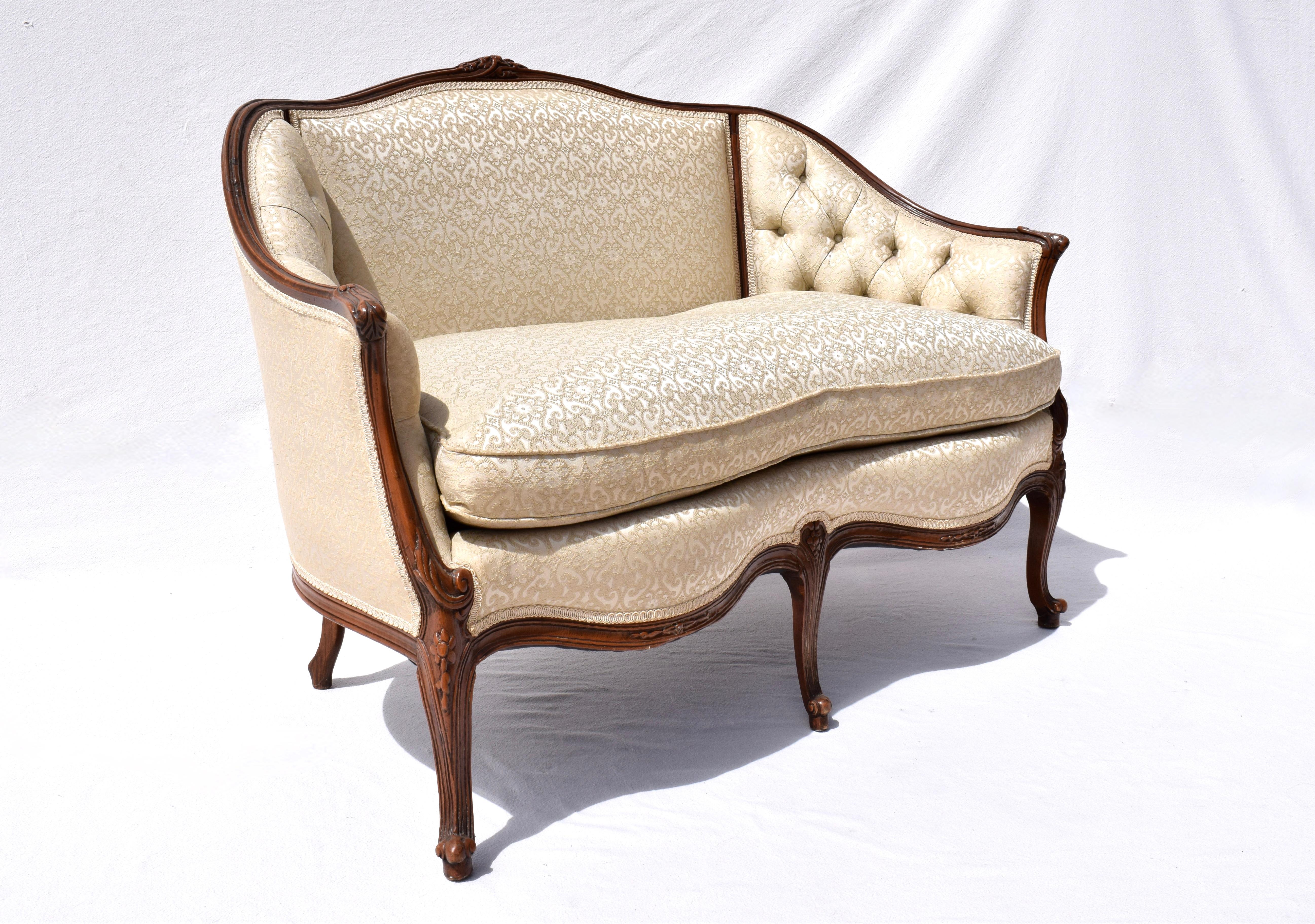 Early 20th C. Louis XV style Canape loveseat settee in tufted brocade with plush goose down loose cushion, wrap around back & hand carvings throughout. A very sweet loveseat of heirloom quality, nicely  maintained & ready for use. Cozy dimensions;