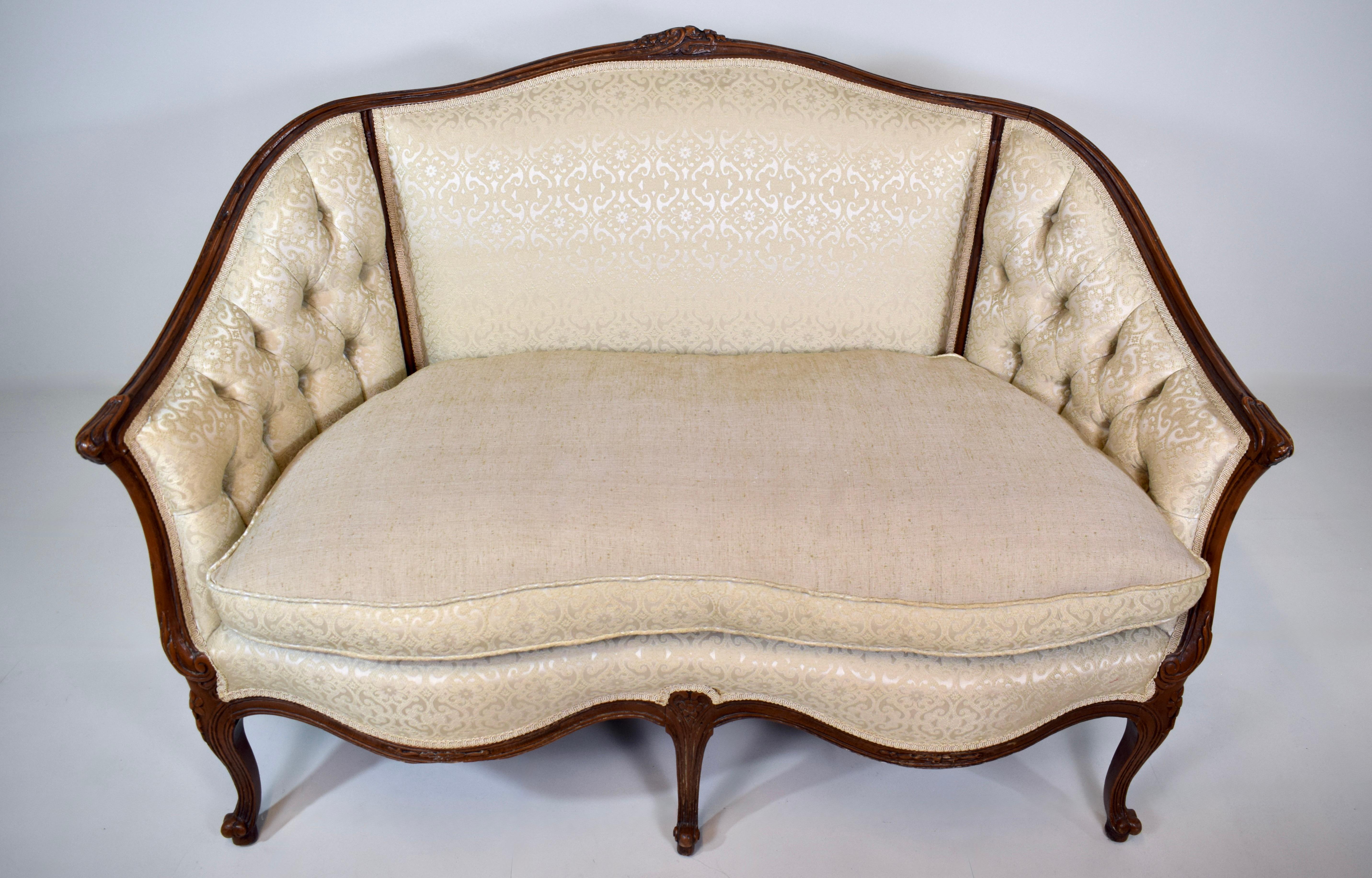 Early 20th C. Louis XV style Canape loveseat settee in tufted brocade with plush goose down loose cushion, wrap around back & hand carvings throughout. A very sweet loveseat of heirloom quality, nicely  maintained & ready for use. Cozy dimensions;