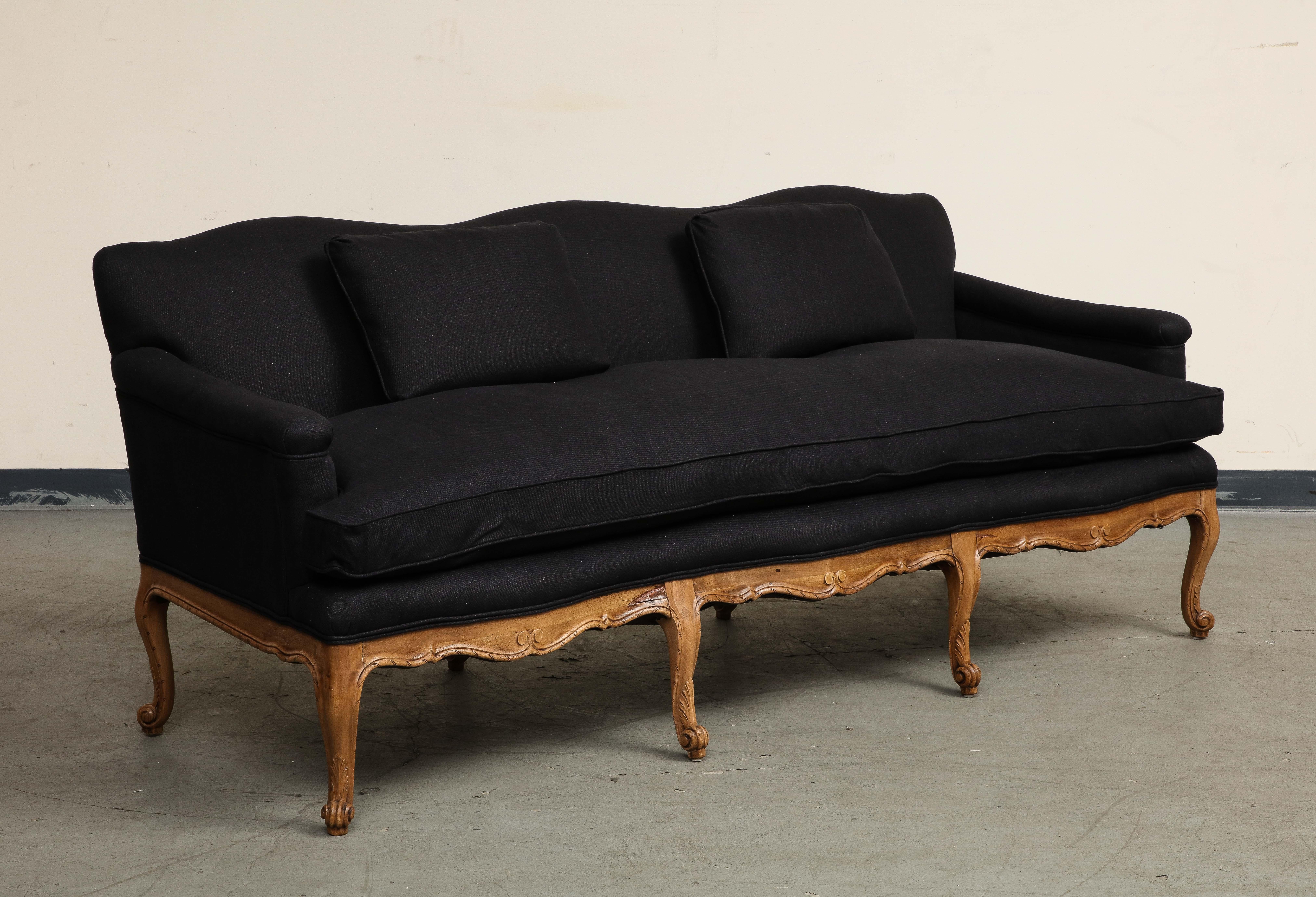 Early 20th Century Louis XV Style French Carved Walnut and Black Linen Sofa