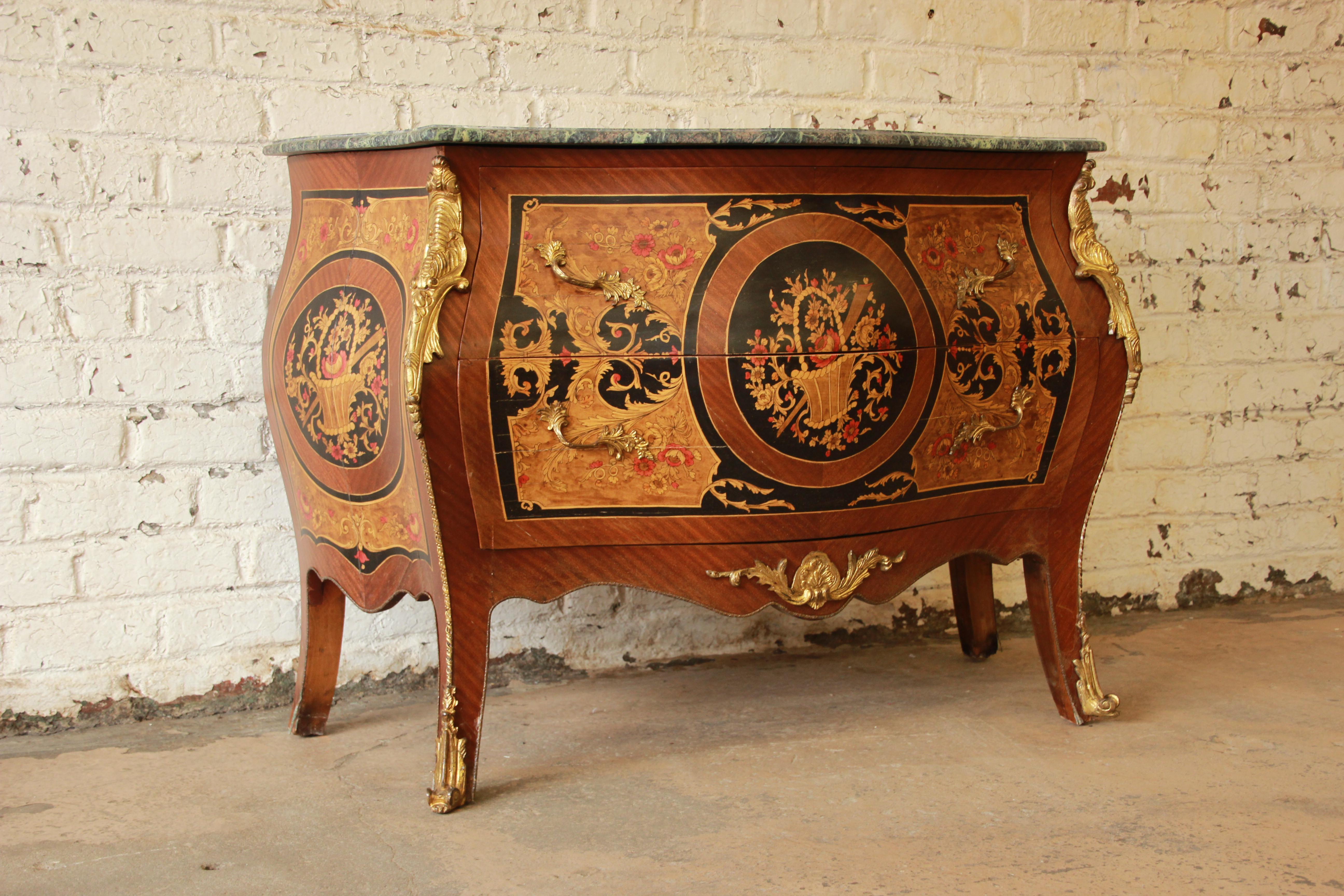Offering a rare and important antique two-drawer bombe shaped Louis XV French commode signed 