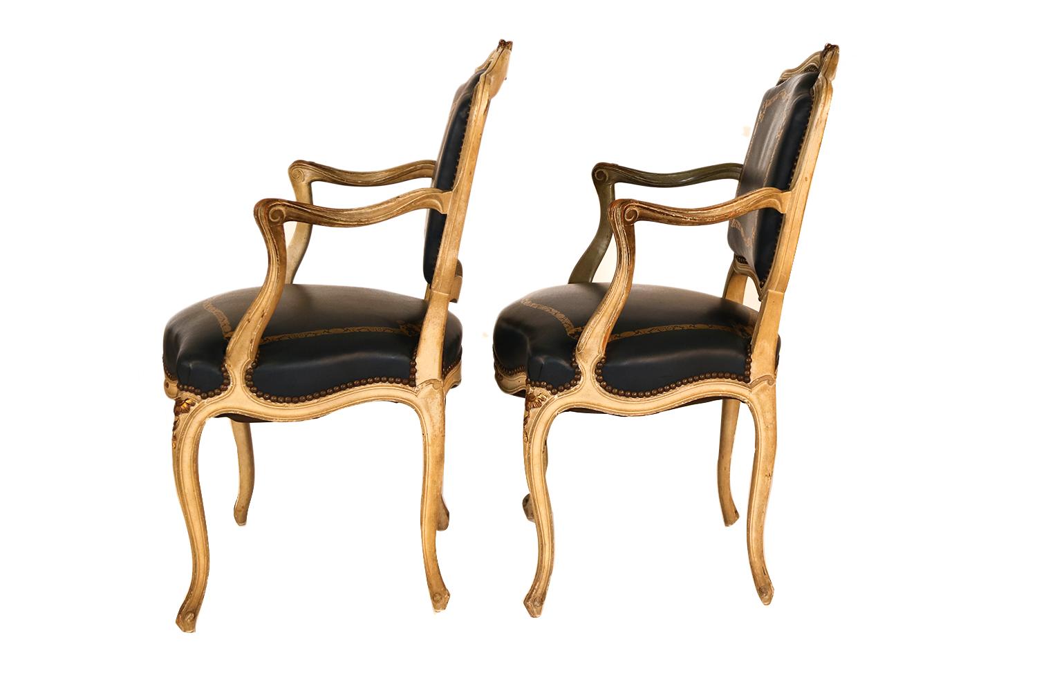 A remarkable pair of Blue mid-late 19th century open armchairs in the Louis XV style, crafted with elegance and charm. They feature a most refined design with gorgeous clean angular lines, original wonderful age throughout the surfaces. The hardwood