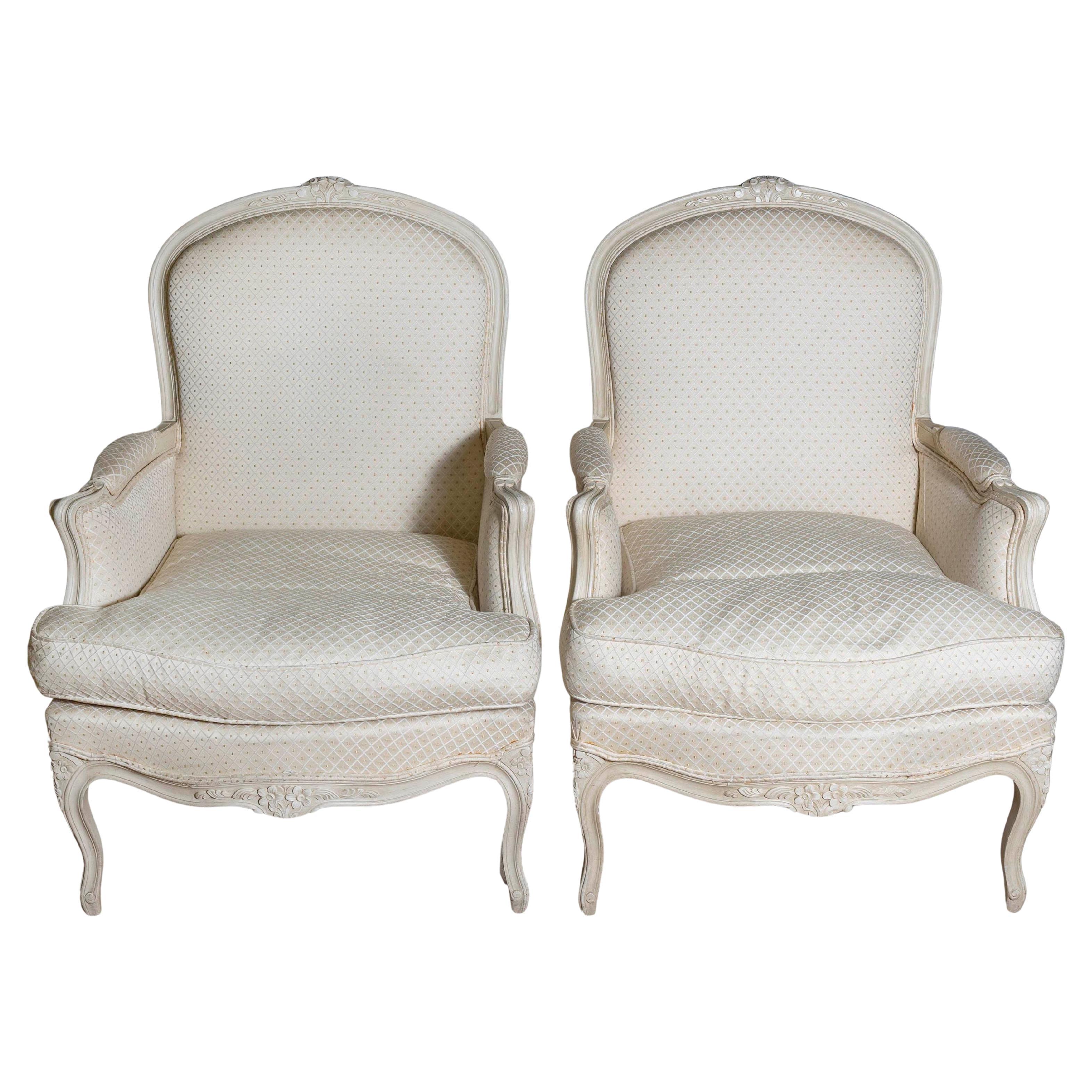 Louis XV Style French Cream Painted Wood Carved Bergères Chairs, a Pair