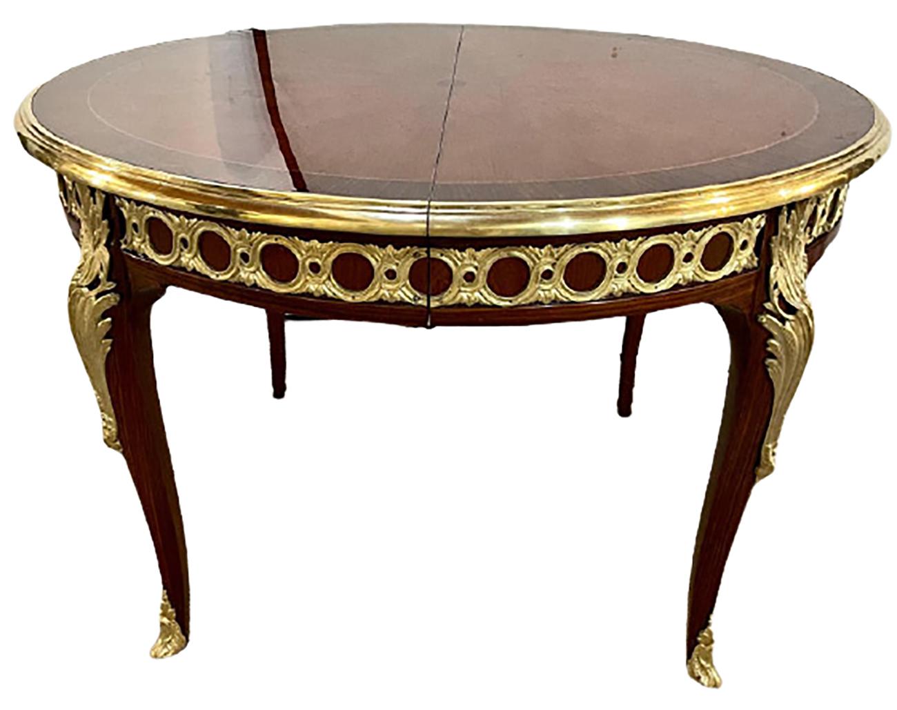 Louis XV style one of a kind / center dining table. Part of our extensive collection of over forty dining tables and chair sets as seen on this site, thus why we are referred to as the King of Dining rooms.
 
 
This simply stunning three leaf dining