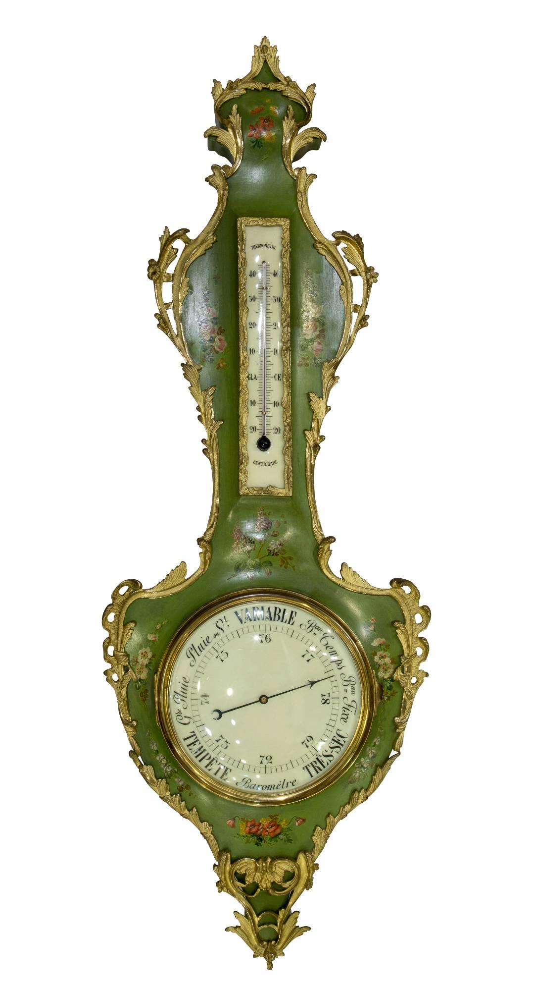 A fine and decorative Louis XV style French Vernis Martin Aneroid barometer and thermometer, decorated in green with floral detail and crisp ormolu mounts,

circa 1900.
          
    