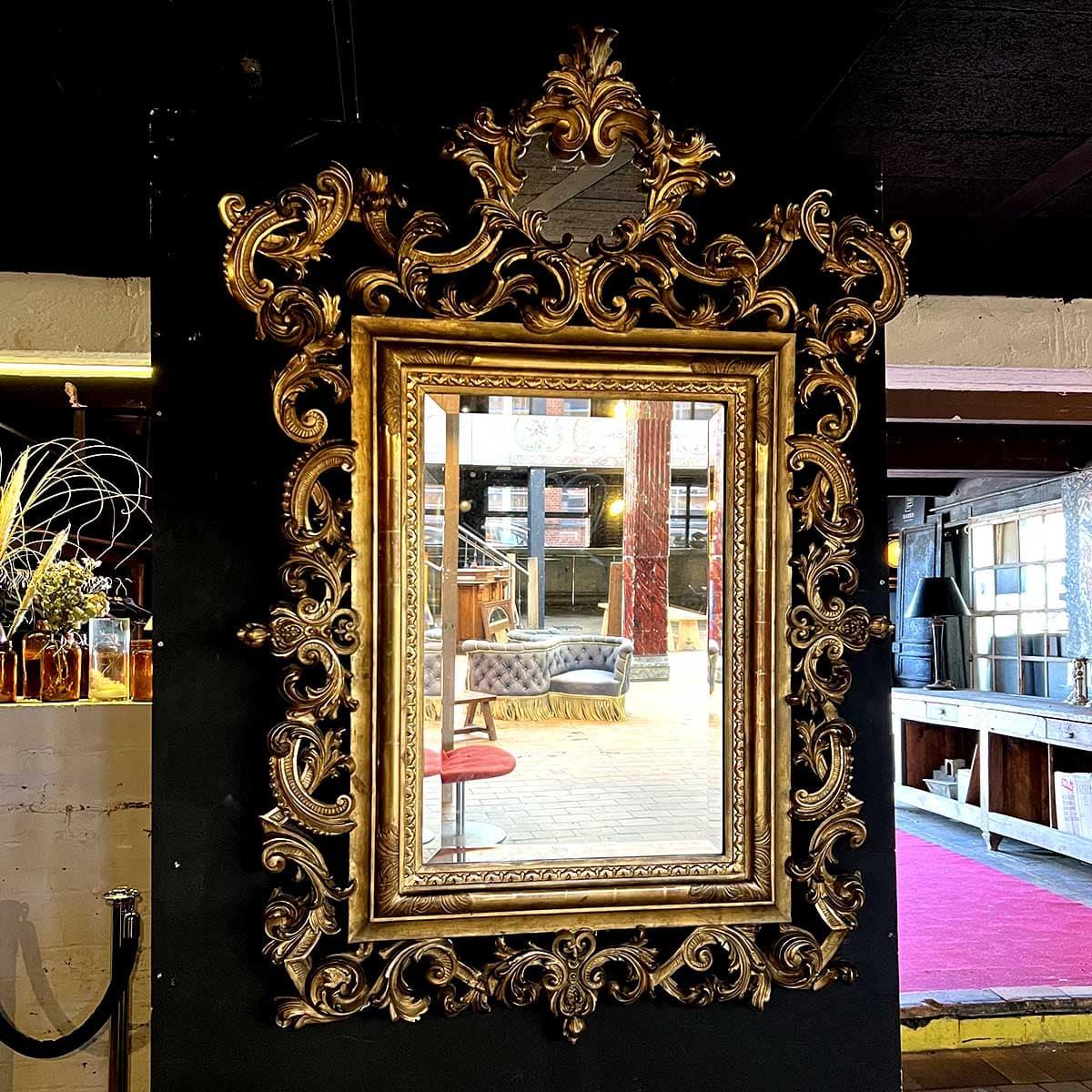 Louis XV Style Gilded Wood and Stucco Rocaille Mirror

A spectacular Louis XV-style mirror, featuring a richly sculpted frame in gilded wood and stucco. The design showcases intricate rocaille motifs with scrolling acanthus leaves, floral garlands,