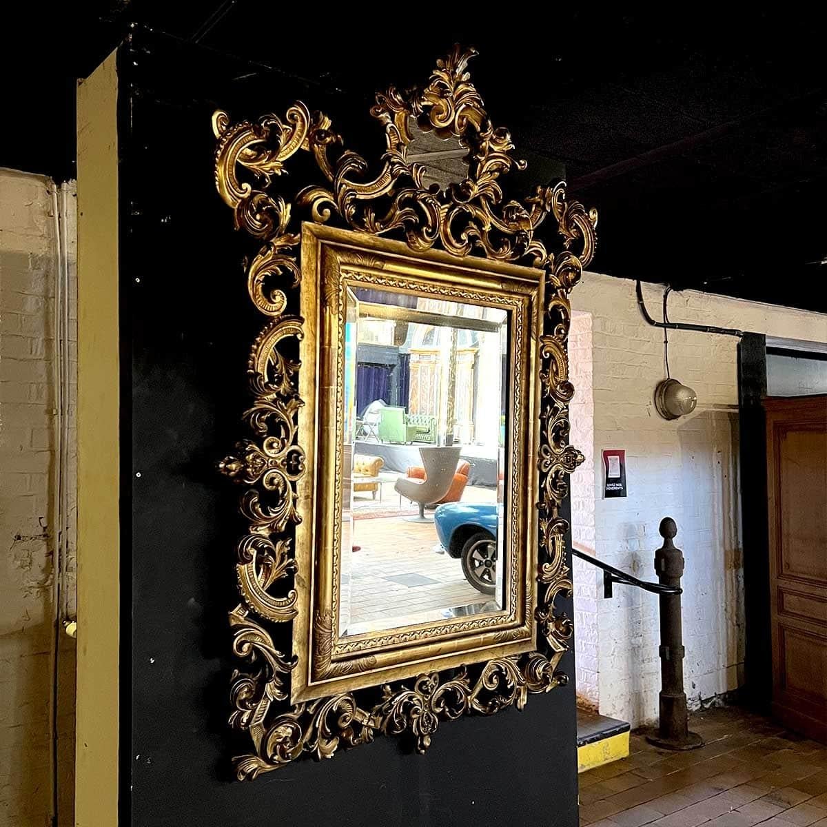 French Louis XV Style Gilded Wood and Stucco Rocaille Mirror For Sale