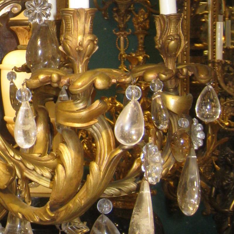 Louis XV style gilt bronze 6-light chandelier with rock crystals.