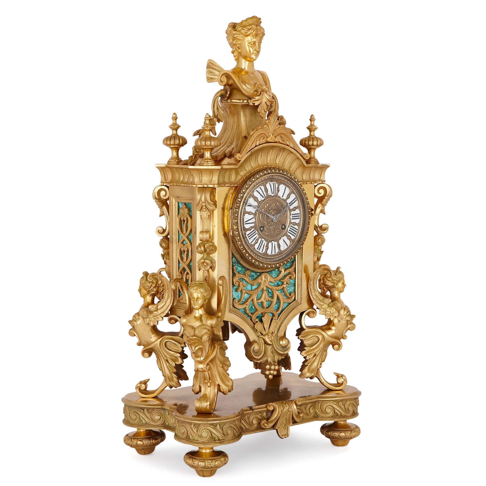 This wonderfully ornate gilt bronze mantel clock is covered with fine sculptural decoration, including female busts, architectural motifs and stylized foliage. With its wealth of classical ornamentation, this clock is clearly inspired by French