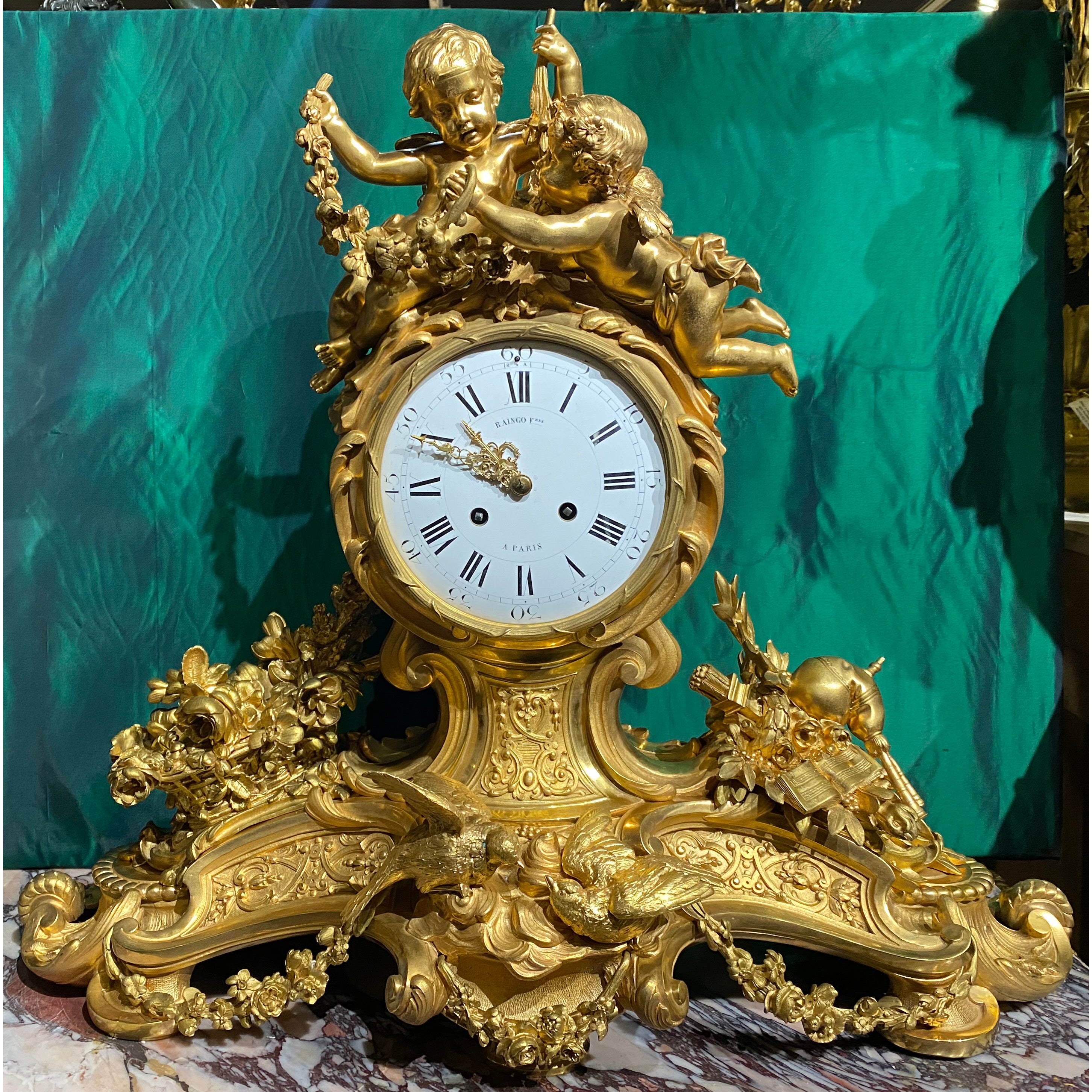 Louis XV style gilt bronze figural mantel clock
Mid/late 19th century
The 8-day time and strike movement with silk thread suspension, dial signed 