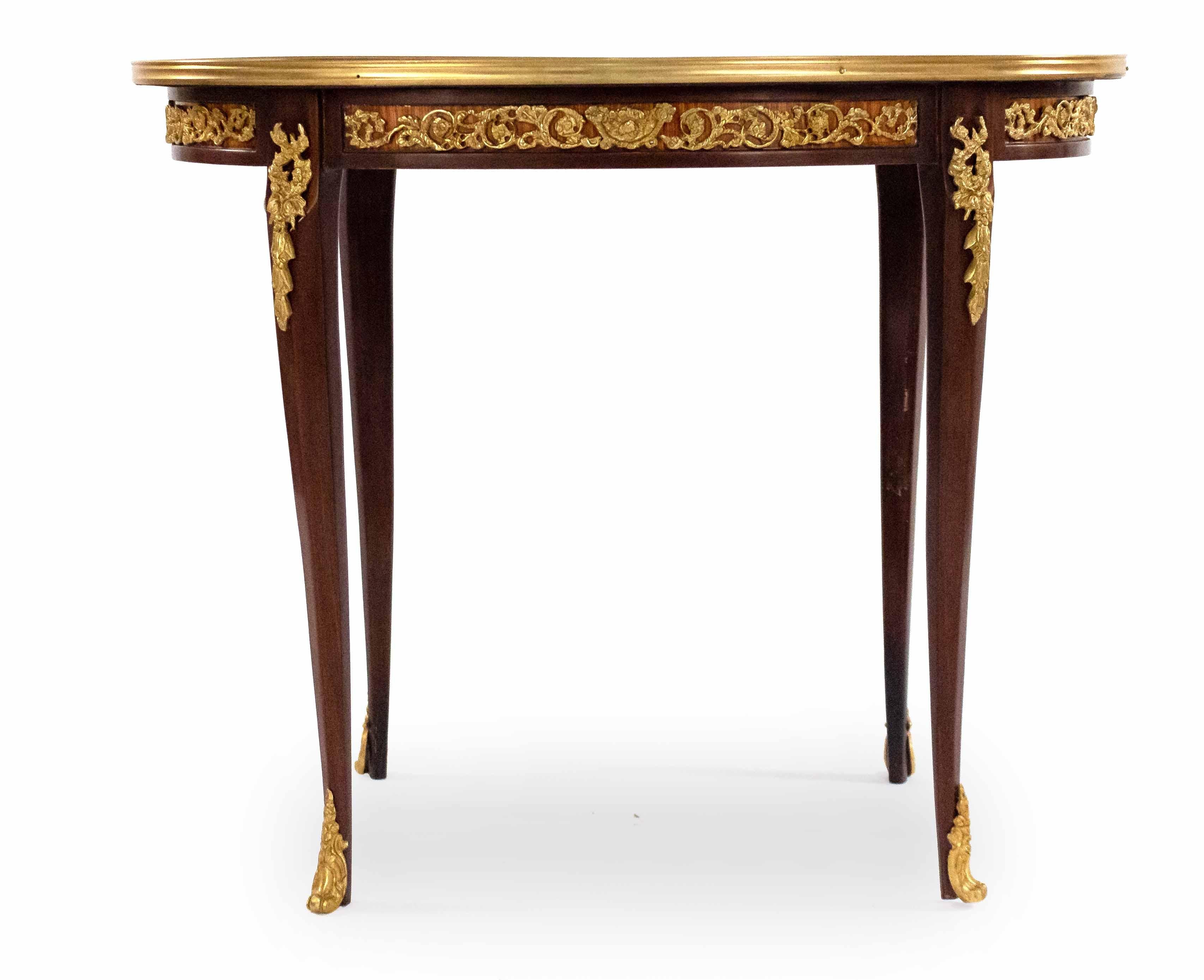 Pair of Louis XV style (20th century) oval side or end tables with basket weave marquetry veneer tops and gilt bronze trim with tapered legs having bronze sabots.