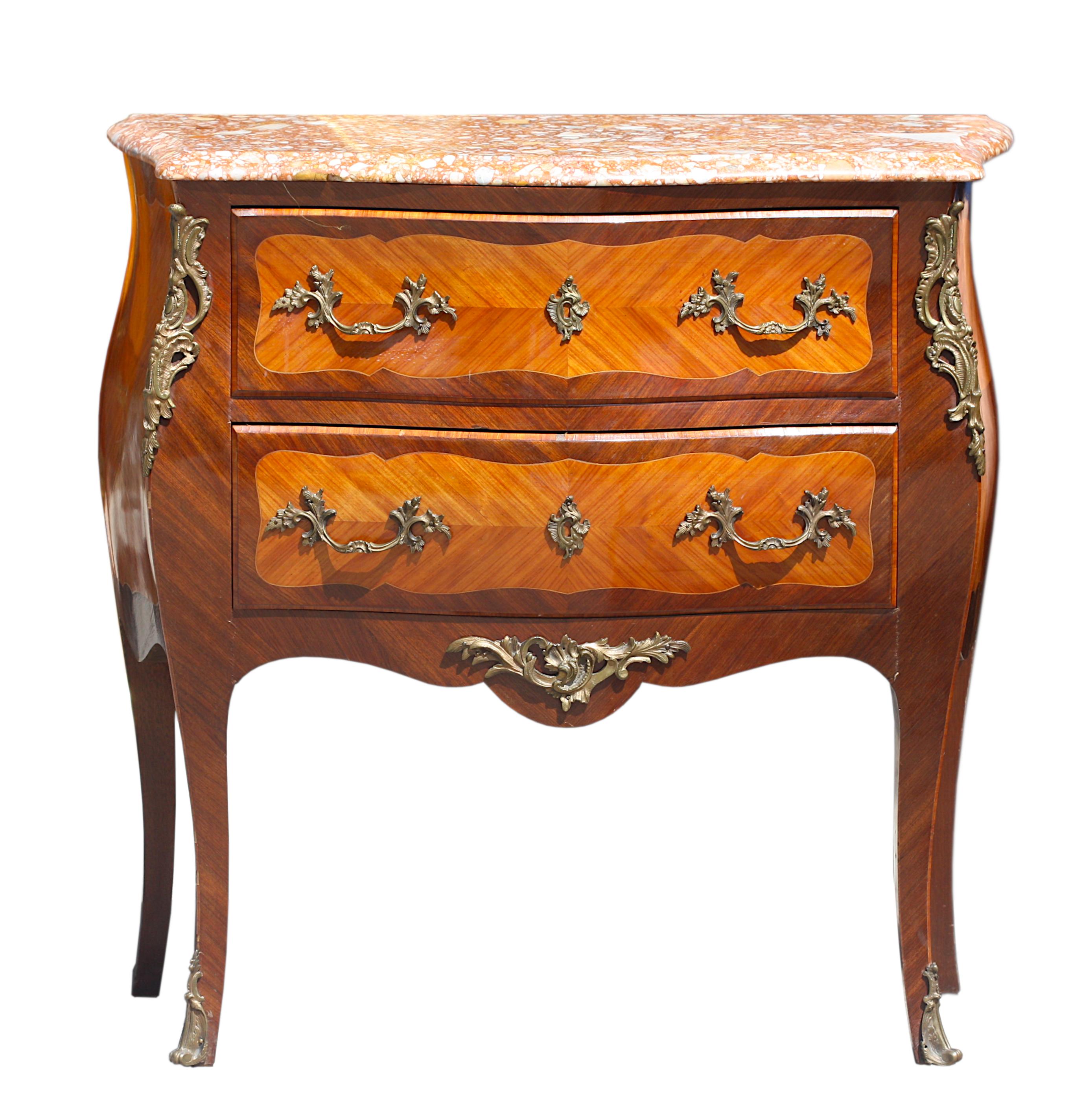
Louis XV Style Gilt-Bronze Mtd. Marble Top Fruitwood Marquetry Commode
The breched aleop serpentine molded marble top above a conforming body fitted with two drawers, centering inlaid foliage, on cabriole legs. 
Height 32 in. (81.28 cm.), Width