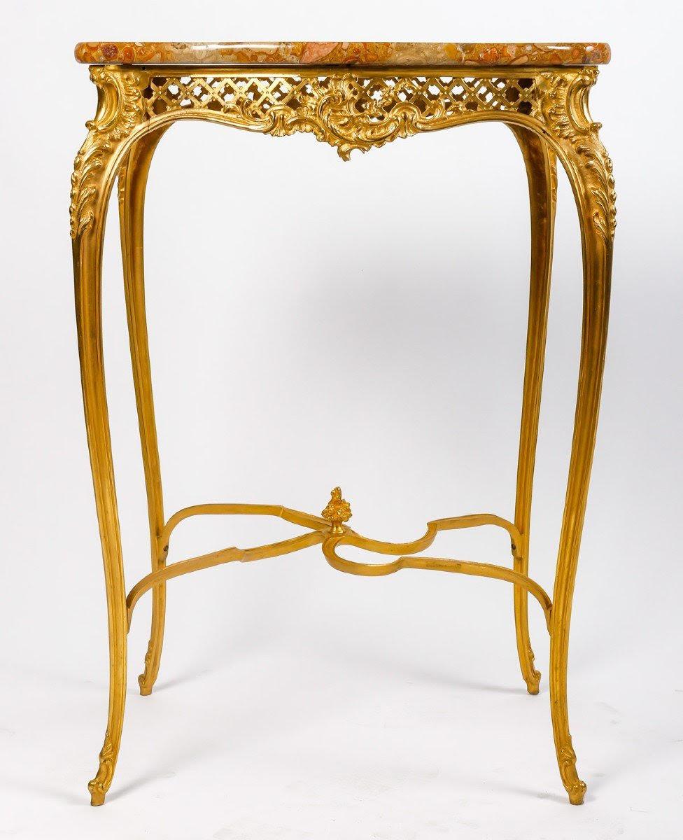 Louis XV style gilt bronze table, marble top, 19th century.

Gilt bronze table, Louis XV style pedestal table, marble top, Napoleon III period, 19th century.  
H: 73cm , W: 48,5cm, D: 37,5cm


