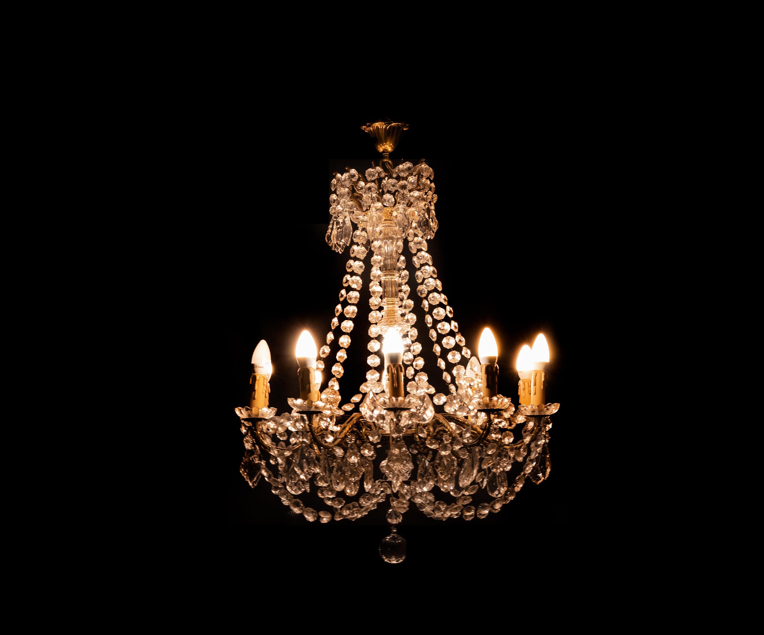 A gilt bronze Crystal and glass chandelier in the Louis XV Style with ten arms. 
Recently rewired with ten illuminants. 
Ready to hang in your selling.

The chandelier is currently wired for both European Union and US standards LED lights. The LED