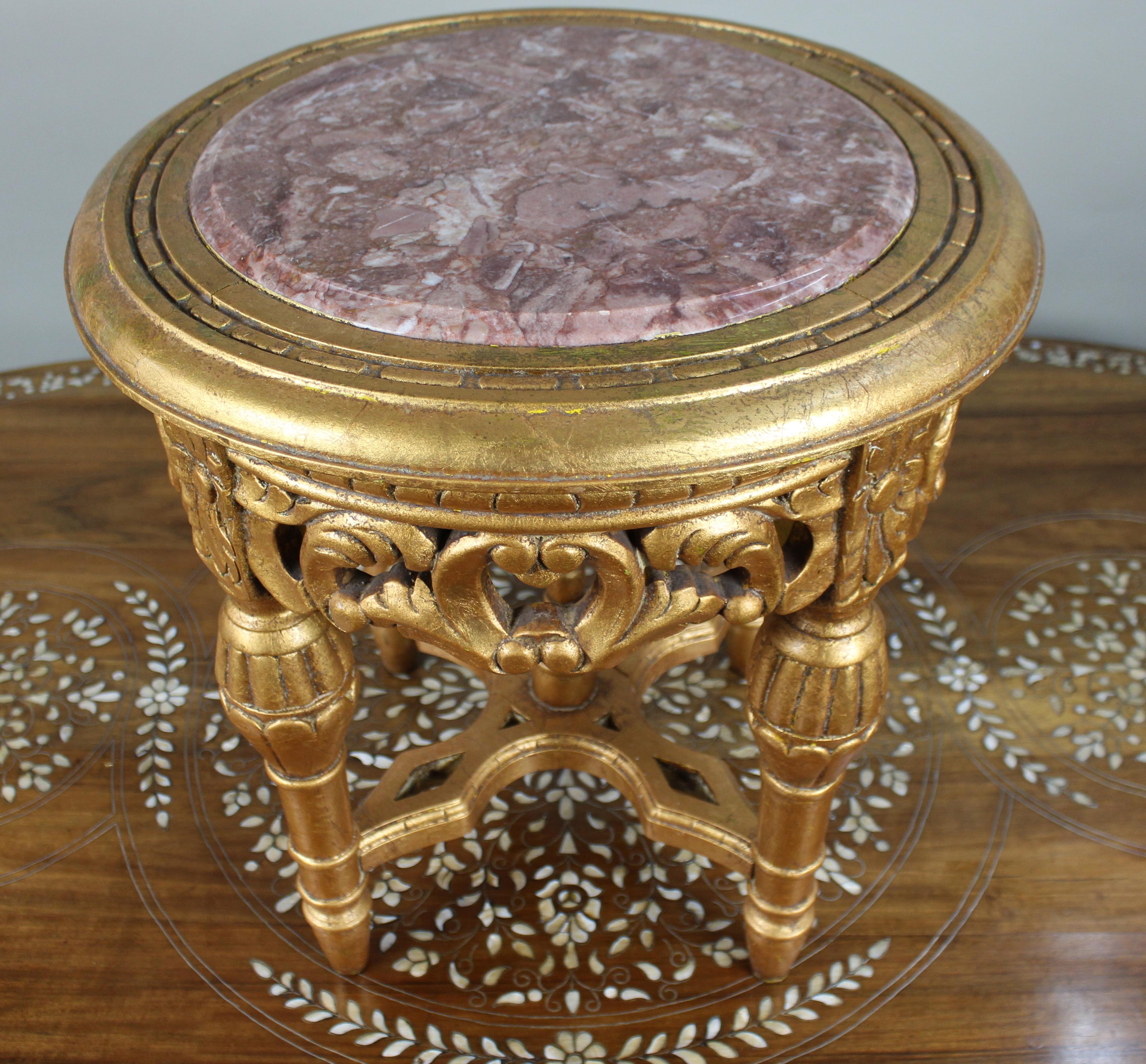 Louis XV Style Giltwood and Rouge Marble Lamp Table


A finely detailed Louis XV-style giltwood occasional table, featuring a circular inset top of richly coloured rouge marble with attractive natural veining in shades of rose and white. The marble