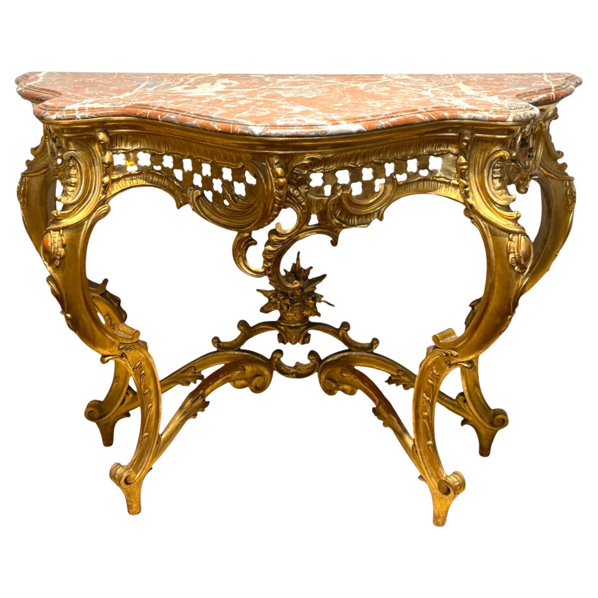 Consola de madera dorada estilo Luis XV con tapa de mármol, S. XIX