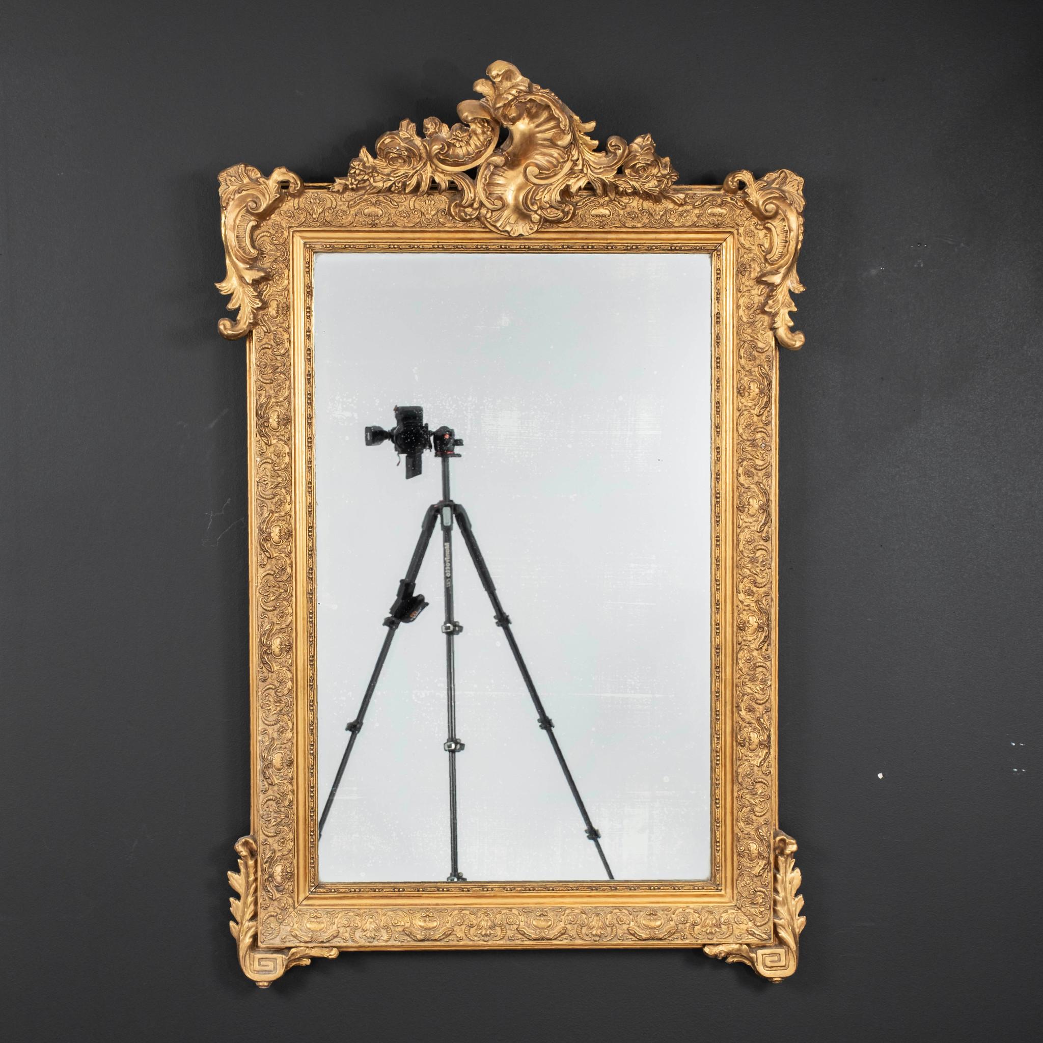 Late 19th Century Louis XV style giltwood mirror.