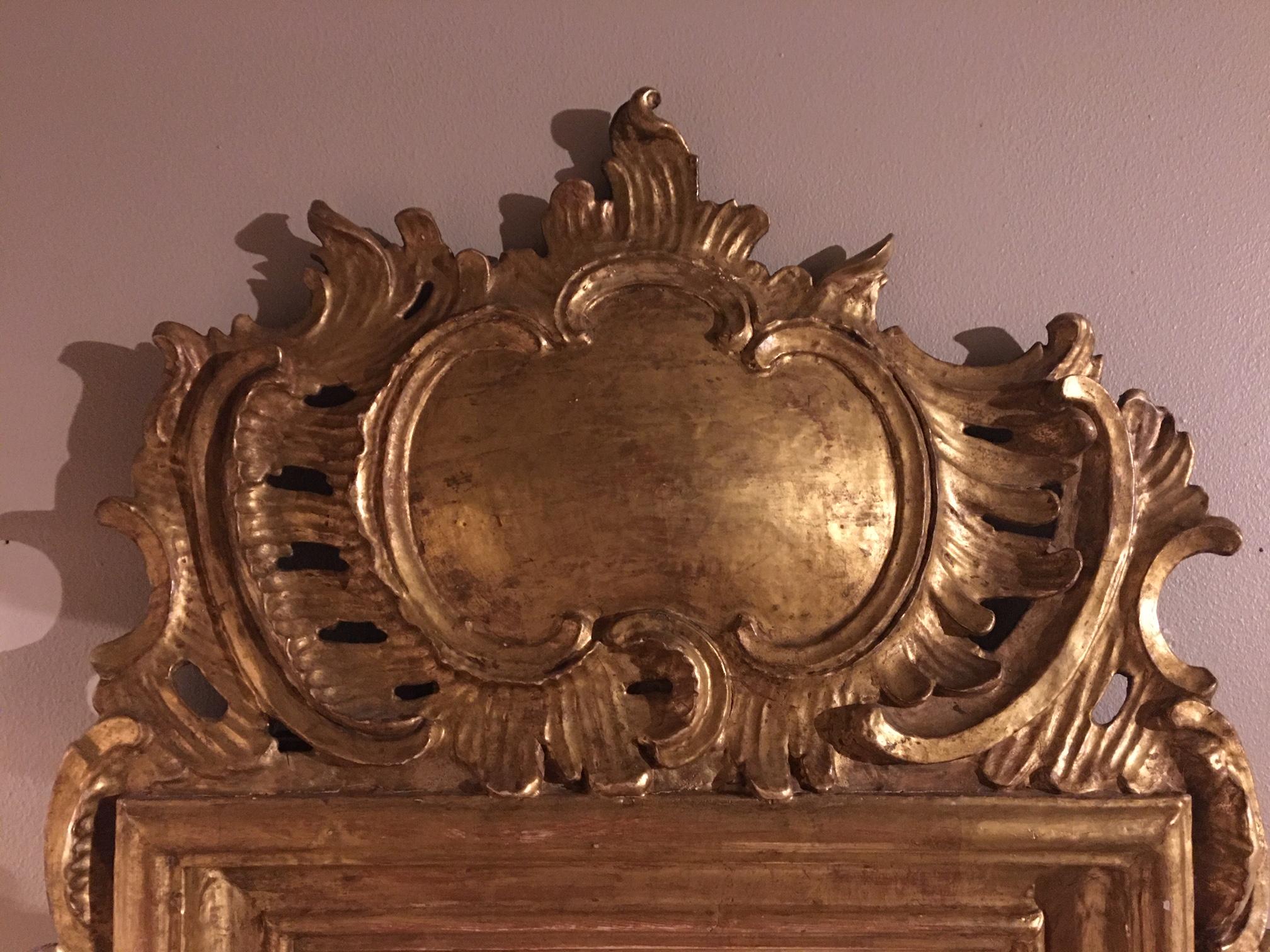 French Louis XV Style Giltwood Mirror with a Foliate Scroll Crest, 20th Century