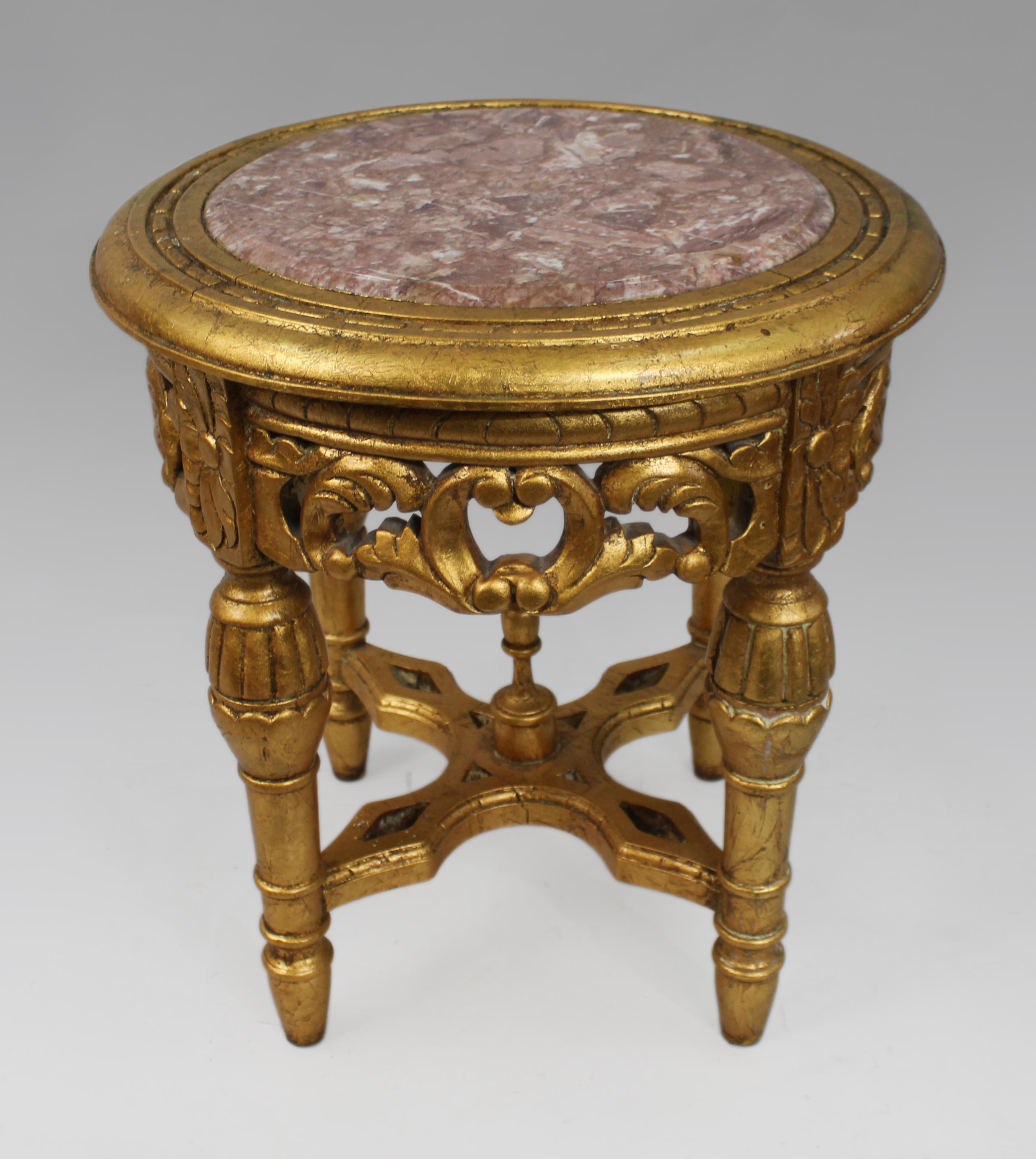 Louis XV Style Giltwood & Rouge Marble Lamp Table
Mid to Late 20th Century

A refined Louis XV-style occasional table featuring a circular rouge marble top with elegant white veining. The giltwood frame showcases hand-carved floral and scroll