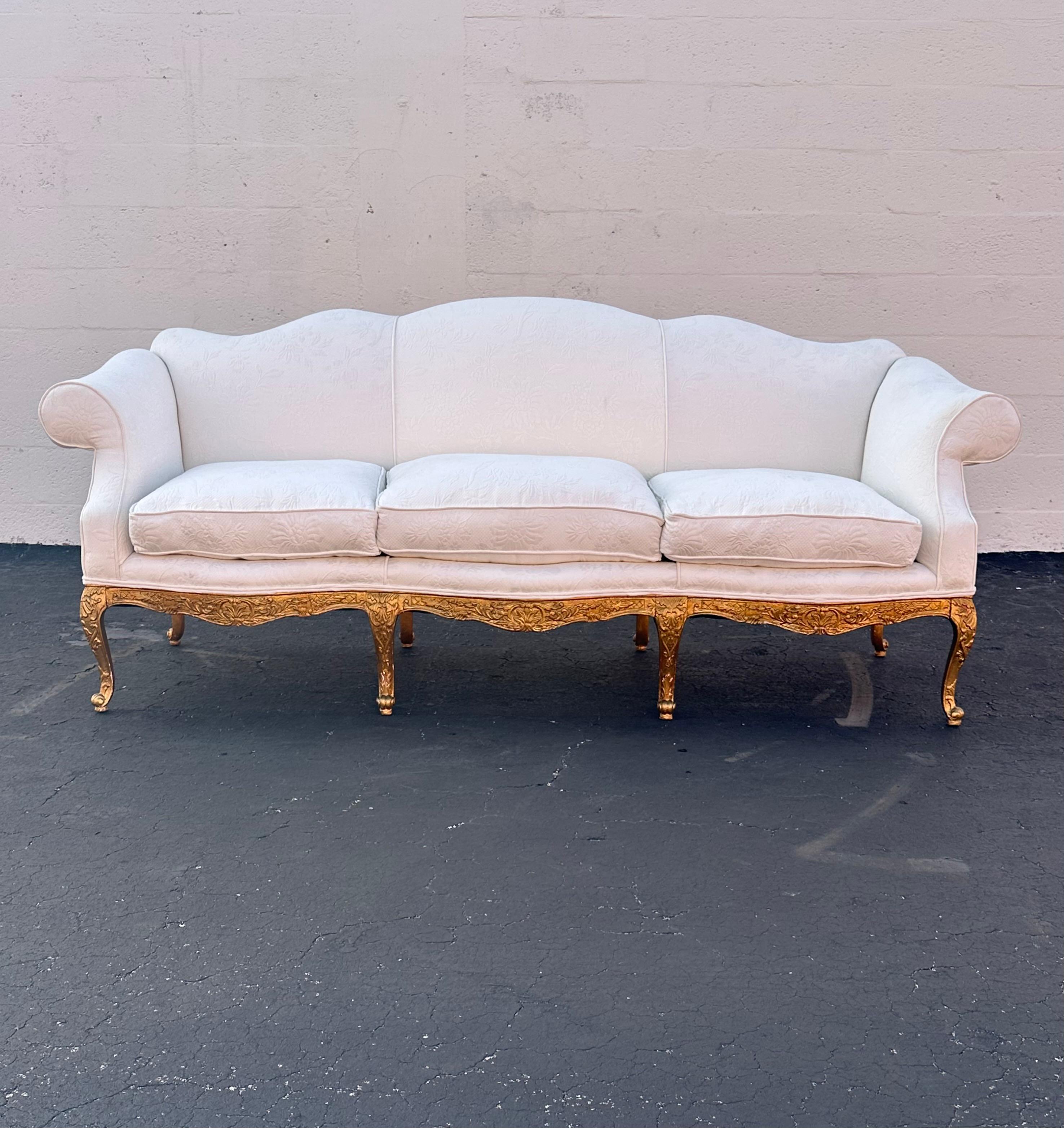 Indulge in the timeless elegance of this exquisite Louis Style Sofa, dating back to the late 19th Century.. Crafted with meticulous attention to detail, this piece showcases a stunning hand crafted finish, ensuring a rich, lustrous appearance that